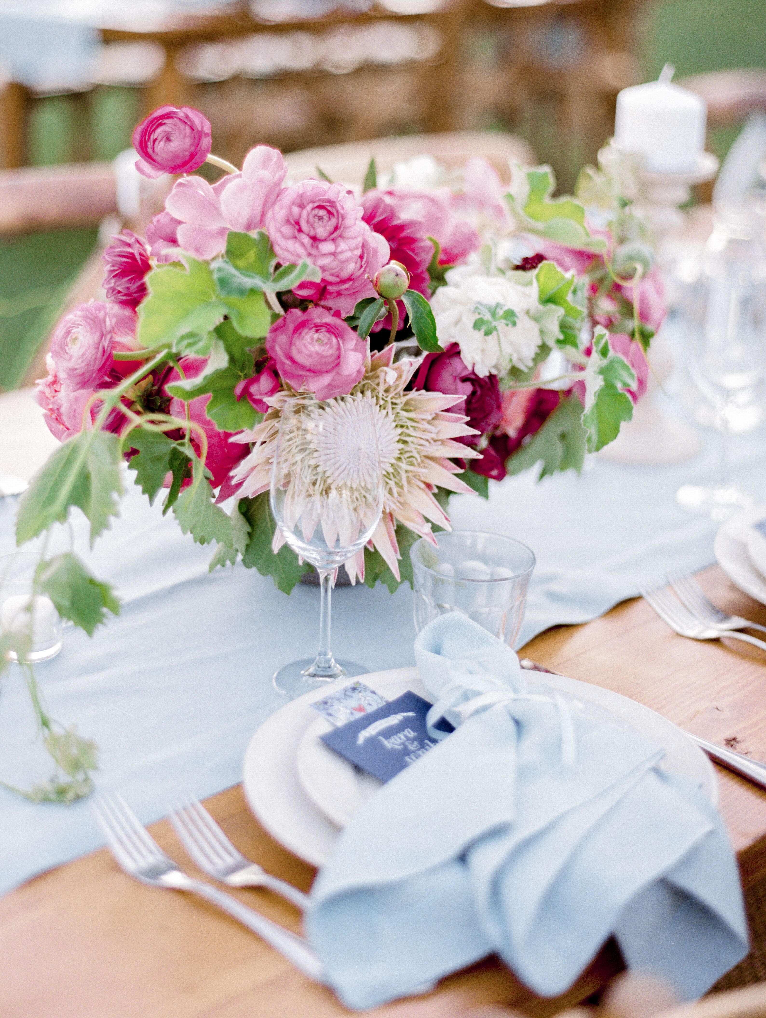Bright Pink Protea and Ranunculus Centerpiece