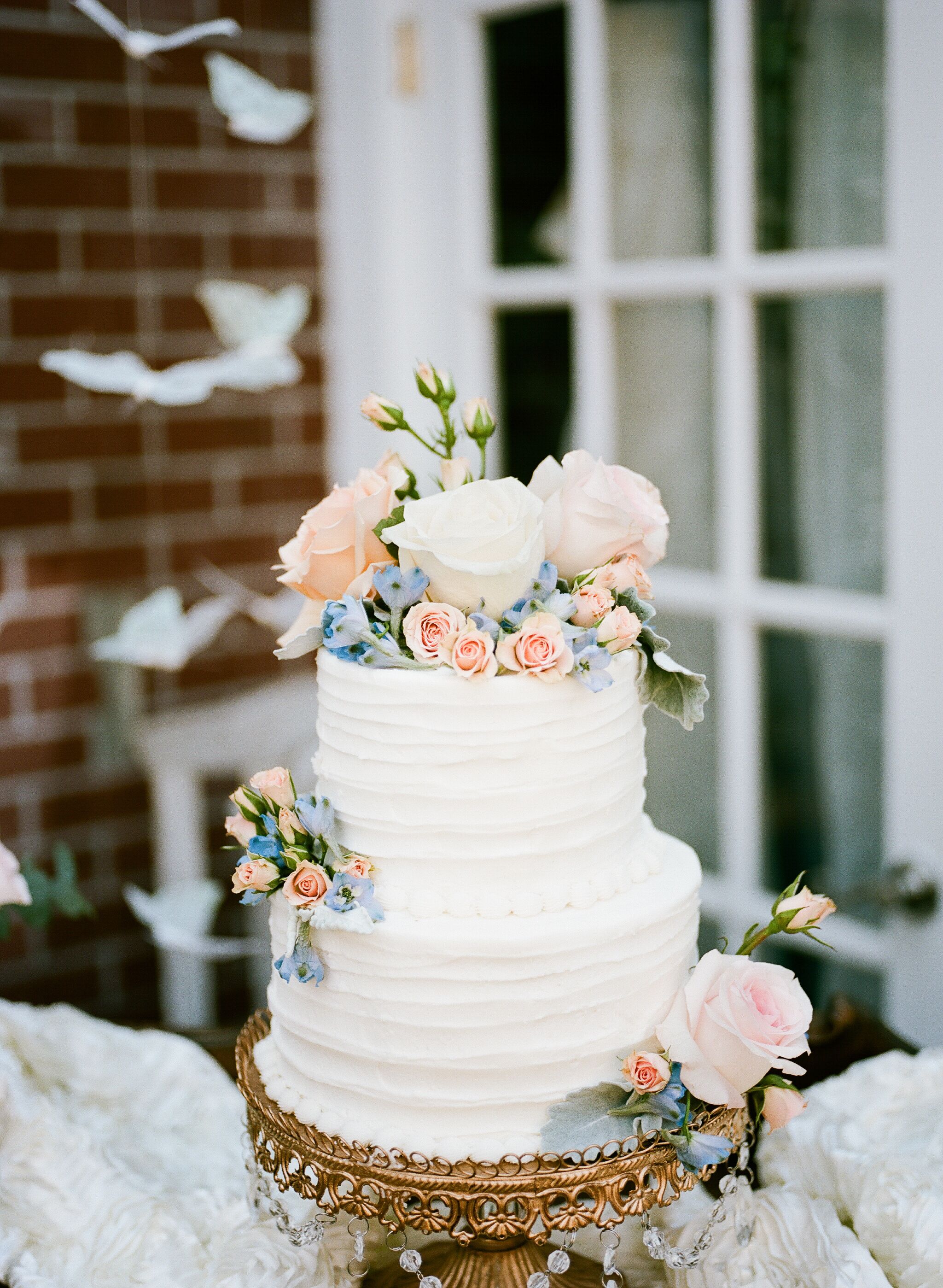  Buttercream  Wedding  Cake  With Blush and Blue Flowers