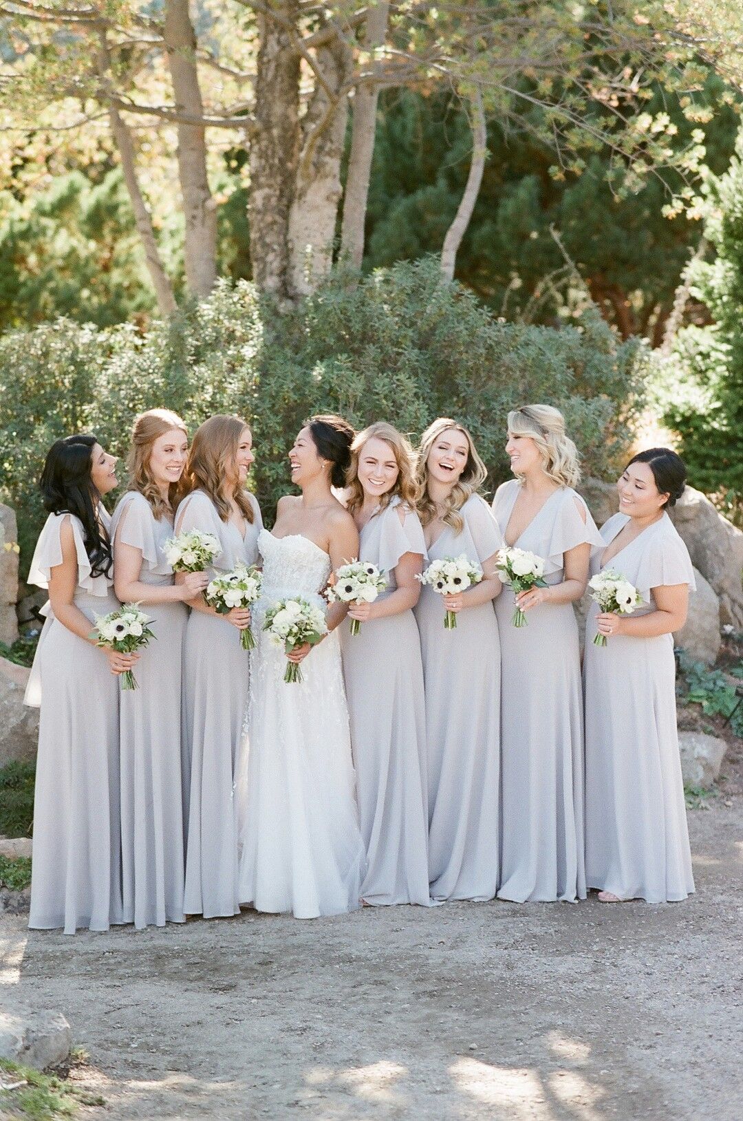 Classic Bridesmaids with Long Gray Dresses and White Bouquets