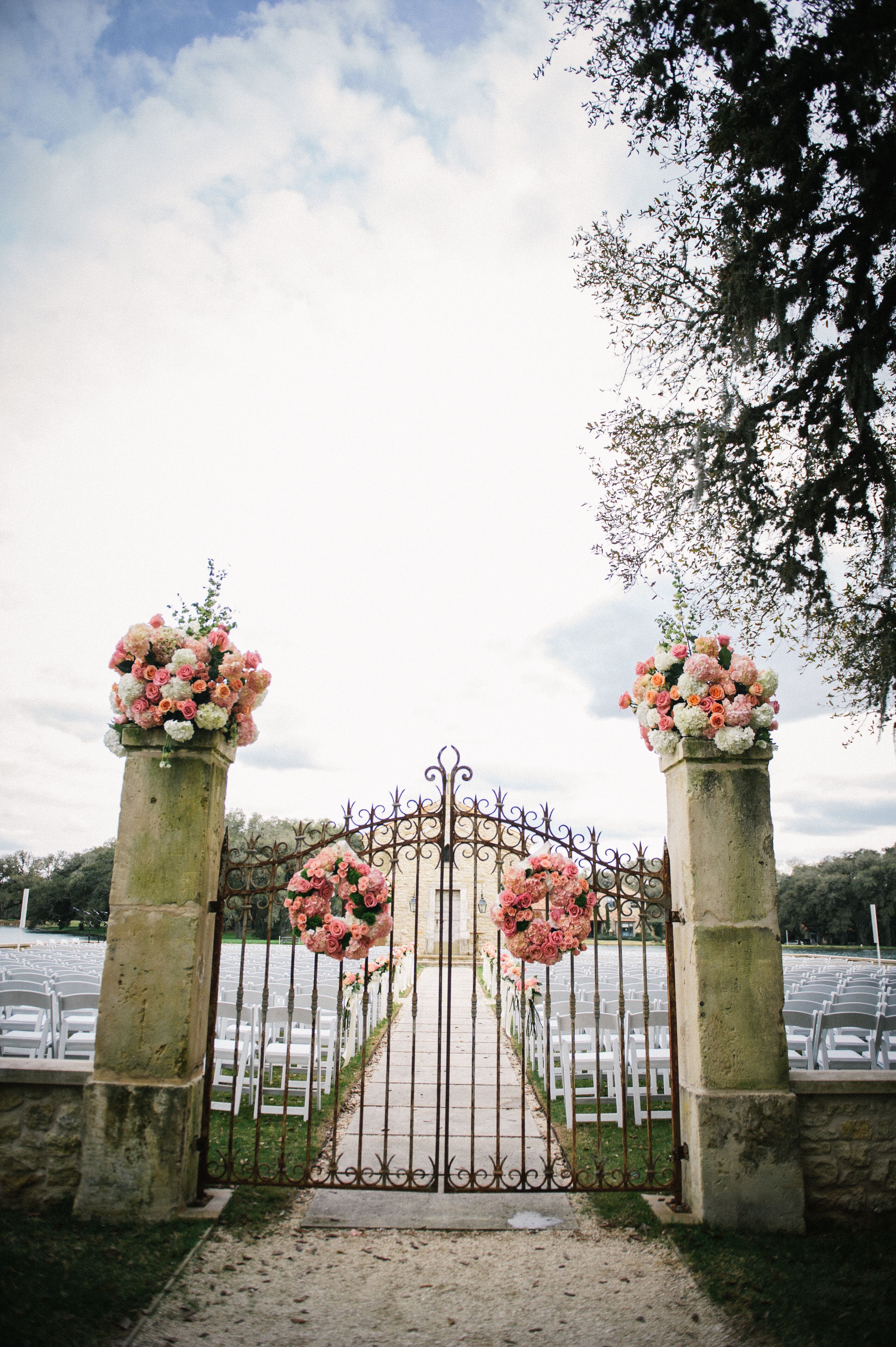 Coral Flower Wreaths on Ceremony Gate