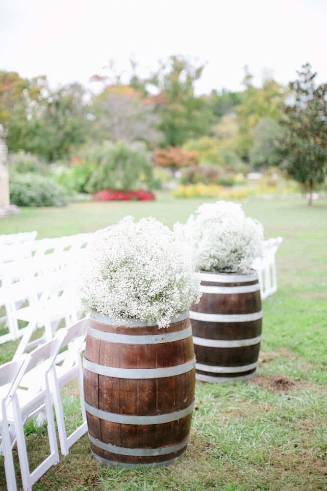 Baby’s BreathTopped Wine Barrel Ceremony Decor