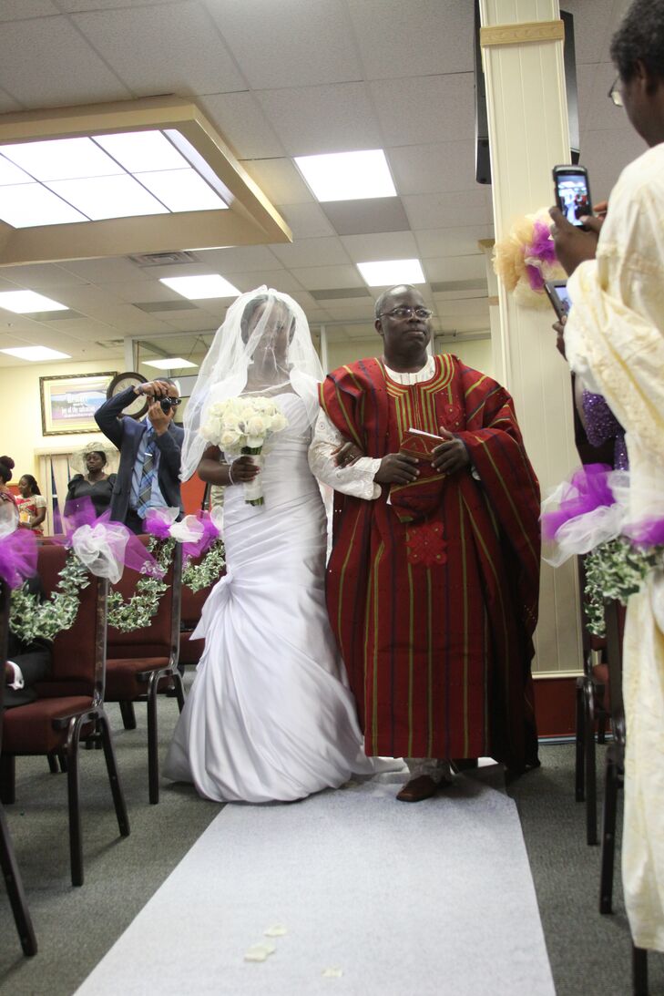 Bride in White Wedding Dress and Father in Nigerian Attire