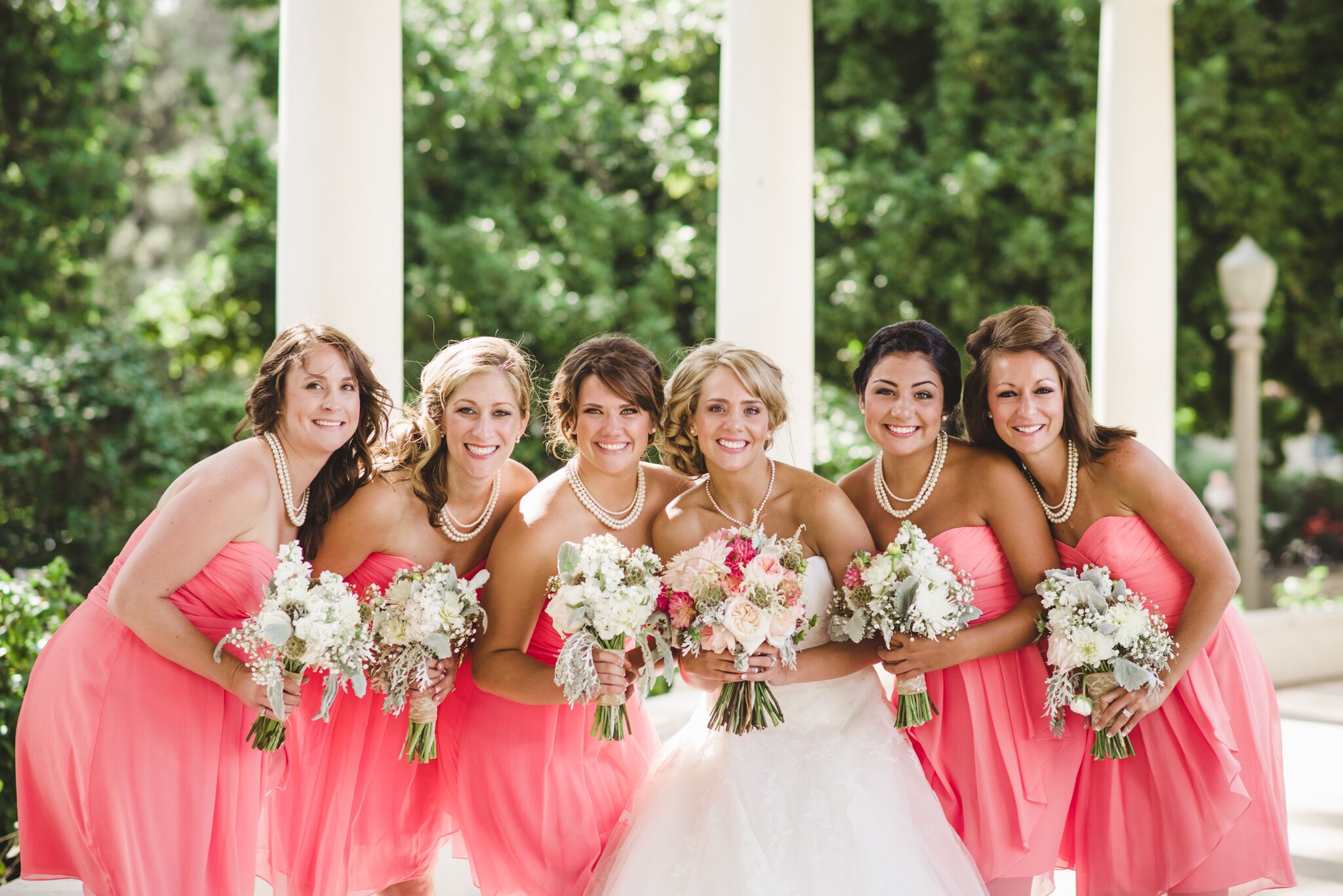 Bride with Bridesmaids in Coral Dresses