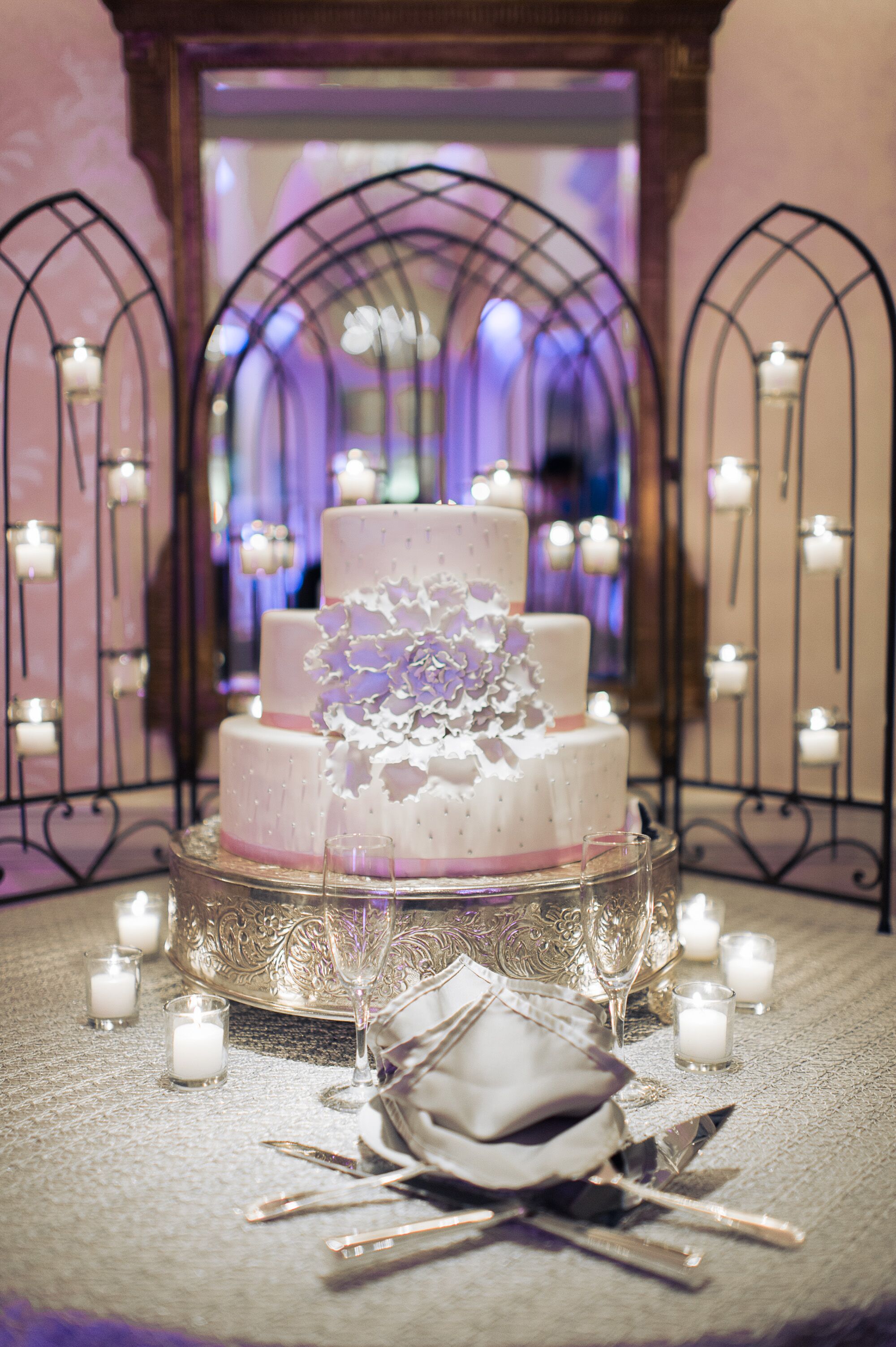 Beautiful Wedding Cake Against a Candlelit Backdrop