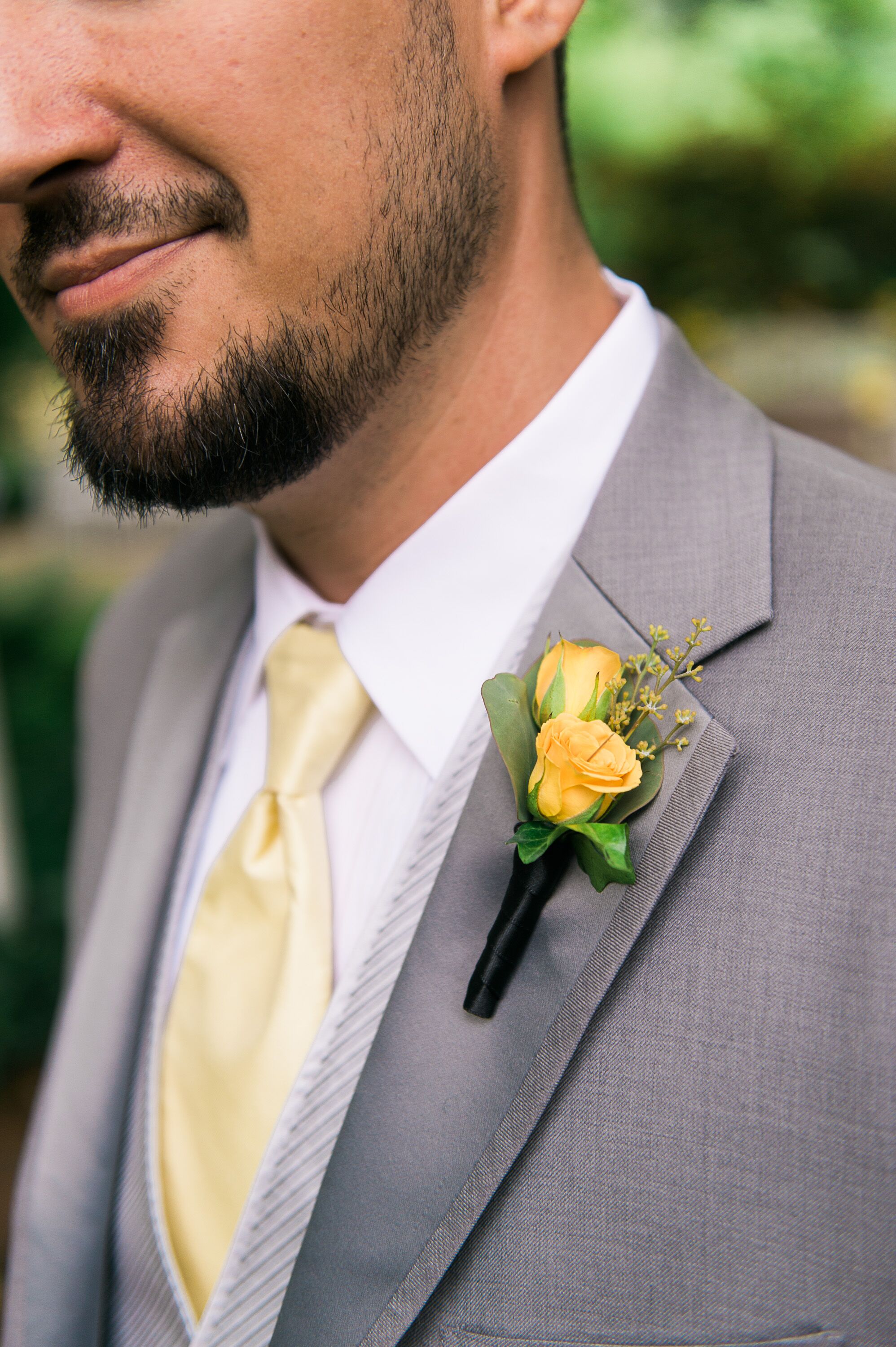 grey suit white shirt yellow tie