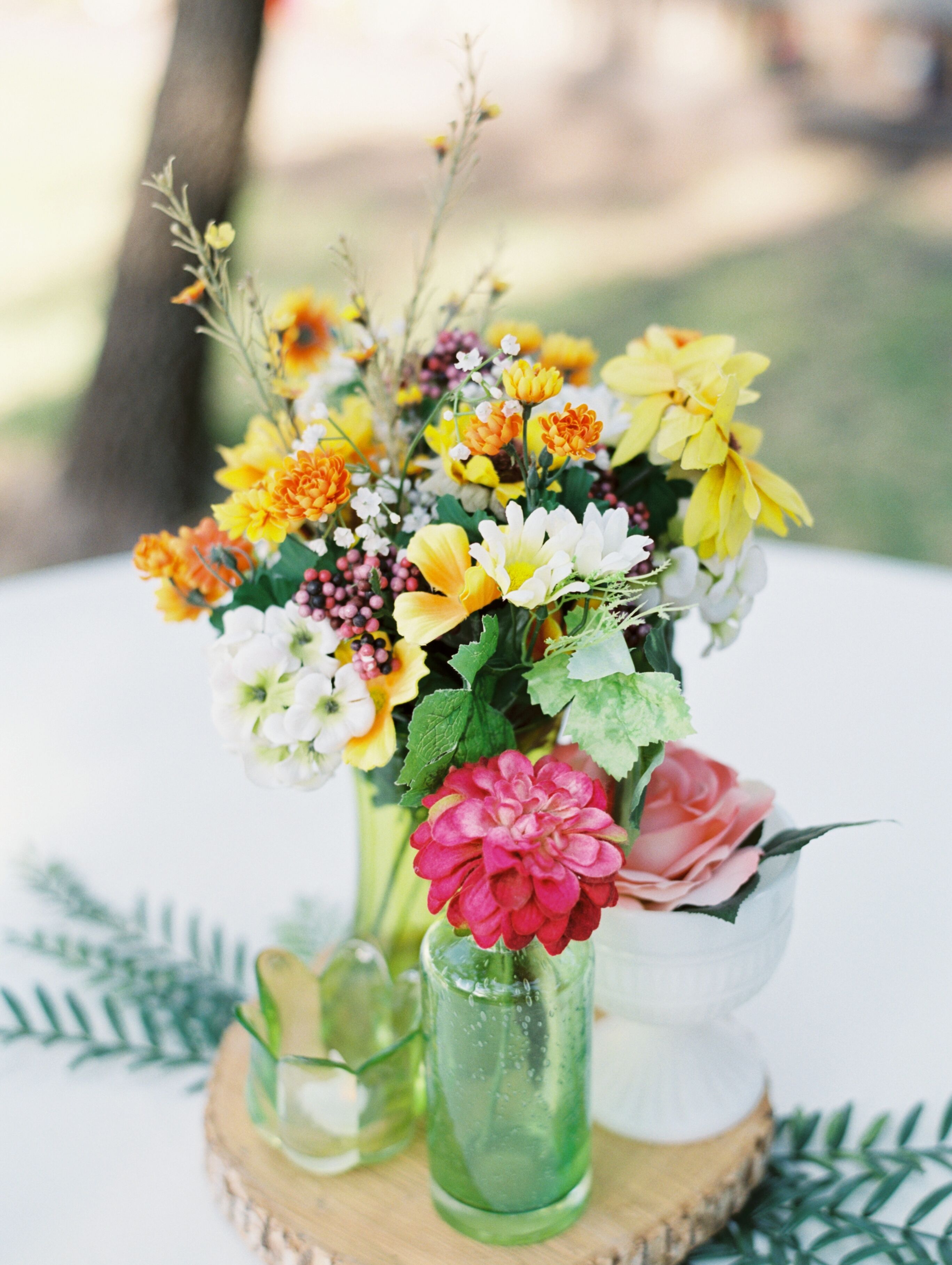 Yellow and Pink Centerpieces in Glass Bud Vases