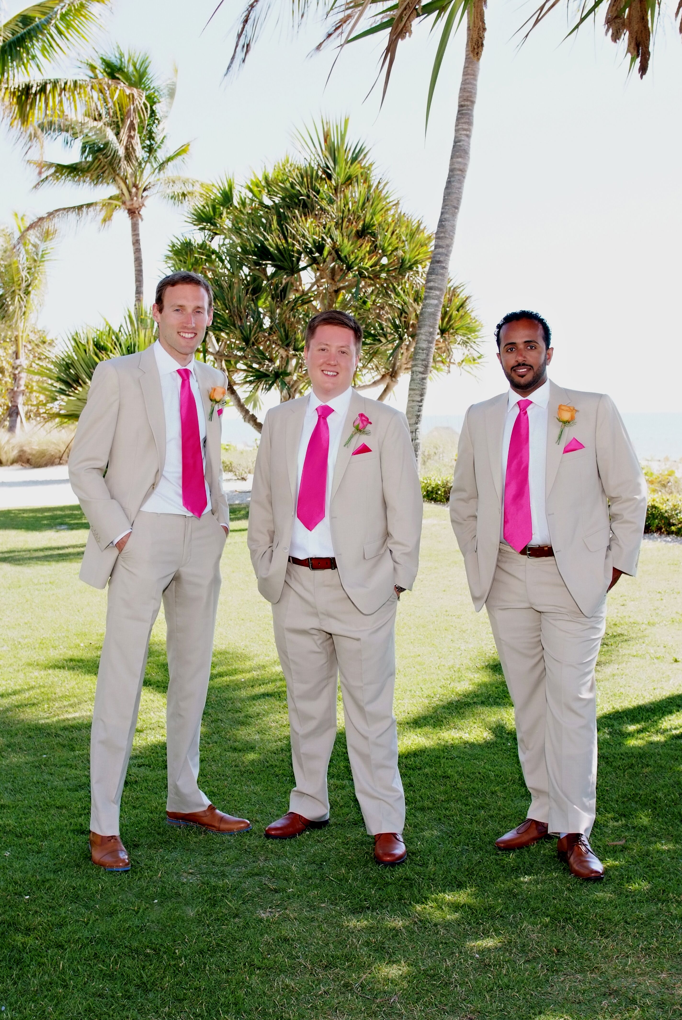 Neutral Groomsmen Suits with Fuchsia Ties