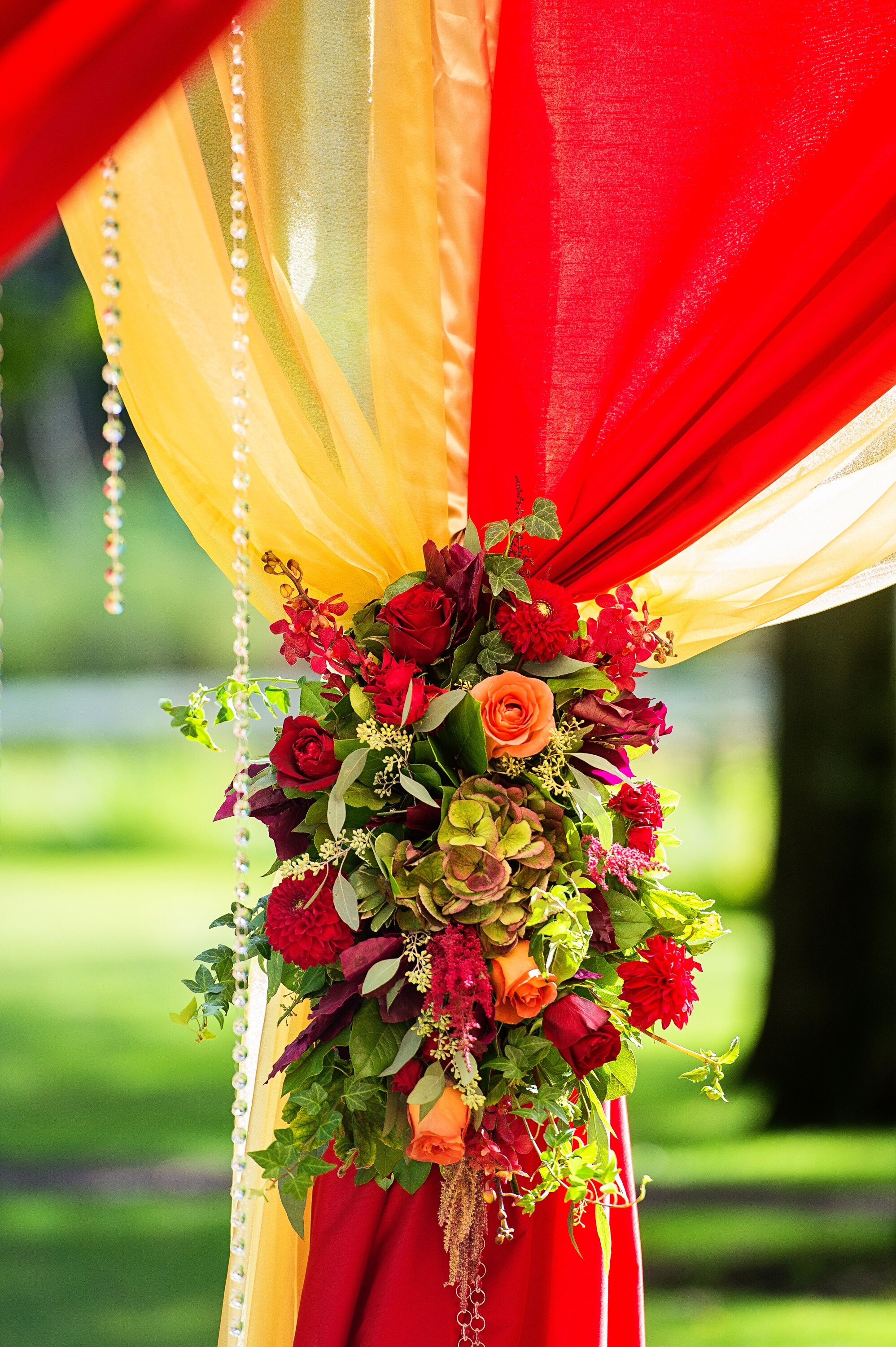 Red and Peach Wedding Huppah Florals