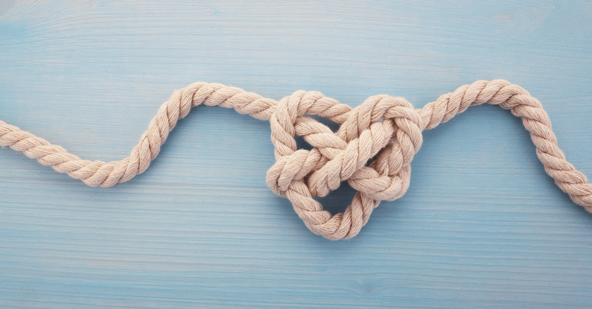 The Tie the Knot Meaning & Origin Story You Should Know