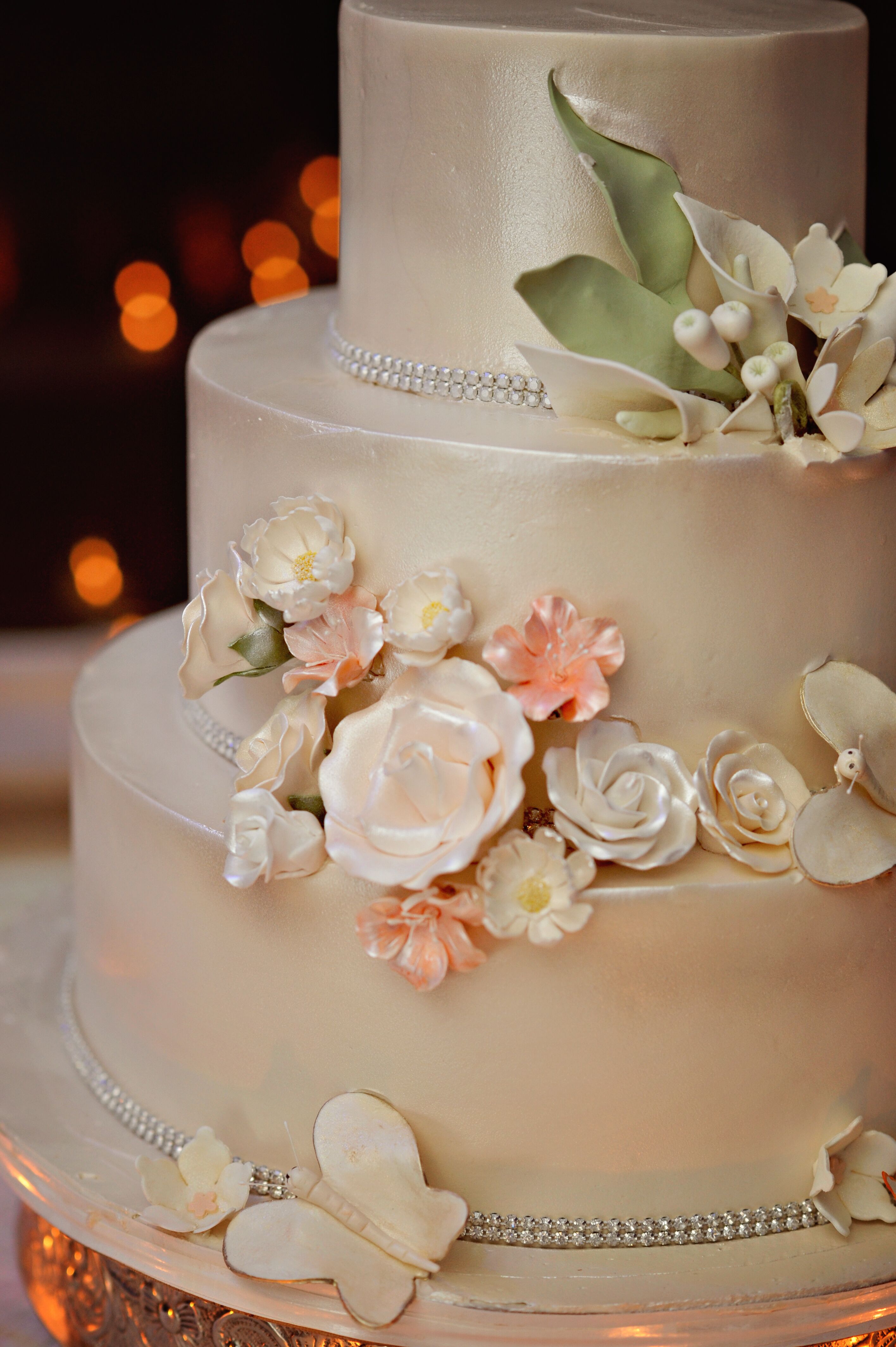 Three-Tier Wedding Cake With Champagne-Colored Luster Dust Floral 