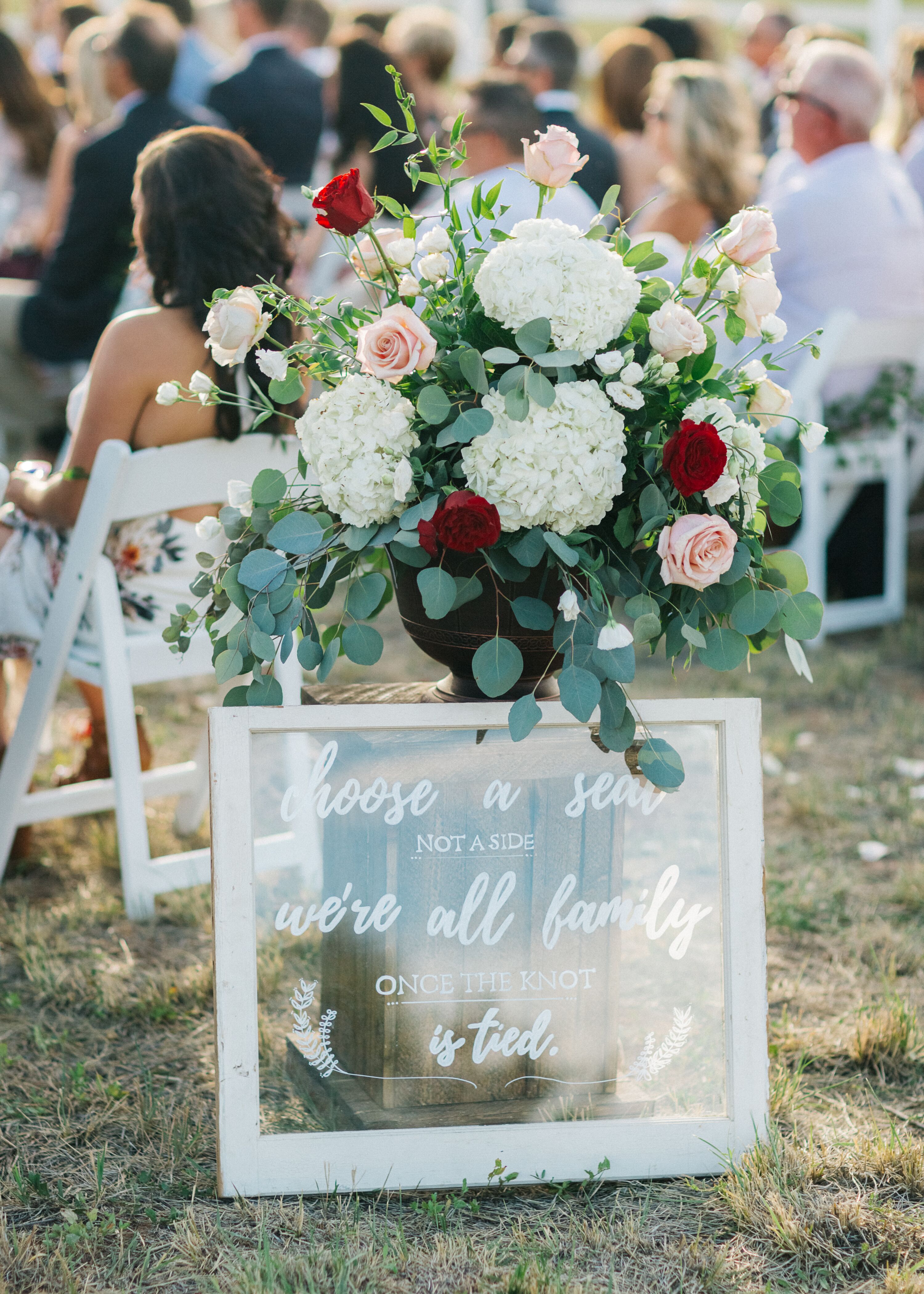 Rustic Welcome Sign with Arrangement of Hydrangeas and Roses