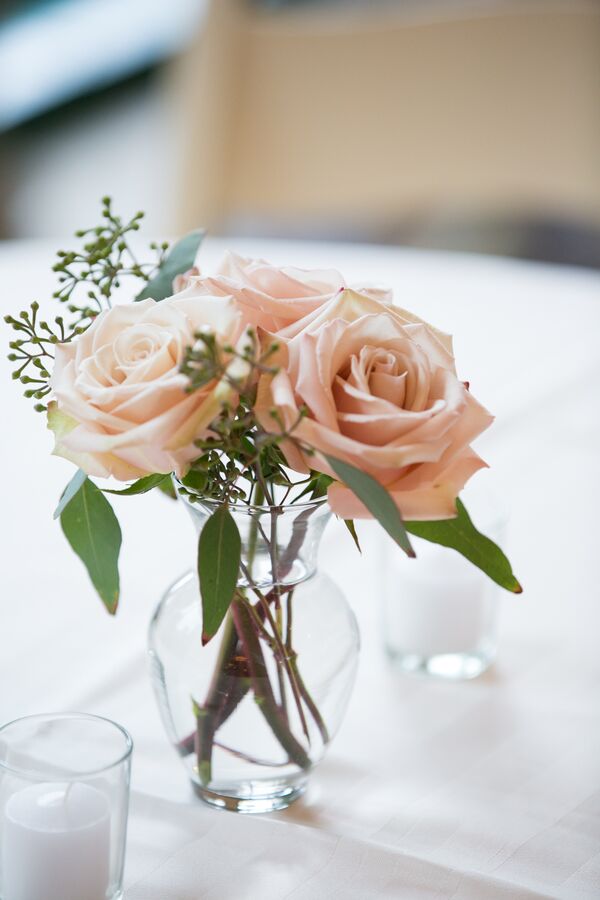 White Fabric Chuppah With Blush Arrangements