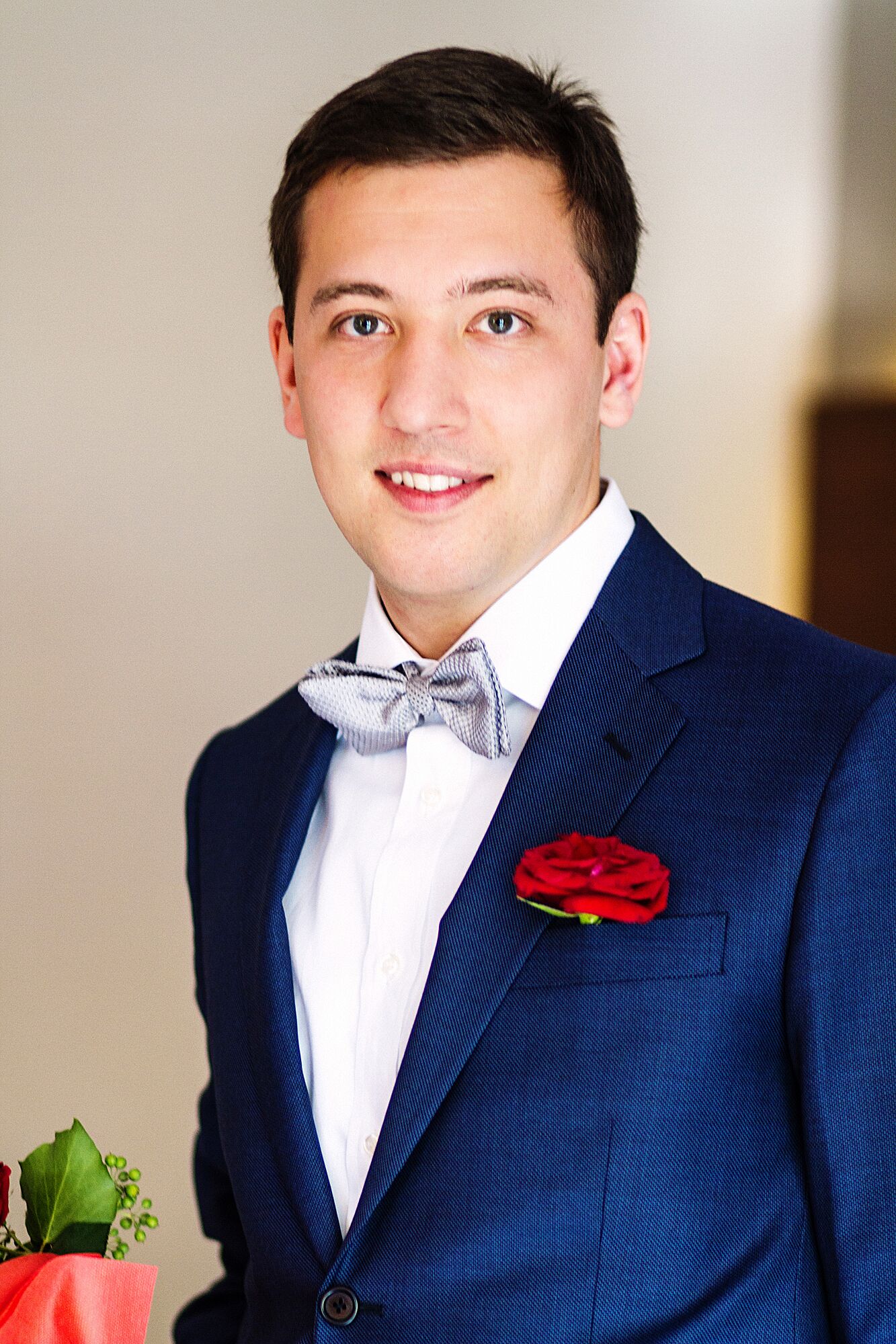 Navy tux with 2025 red bow tie