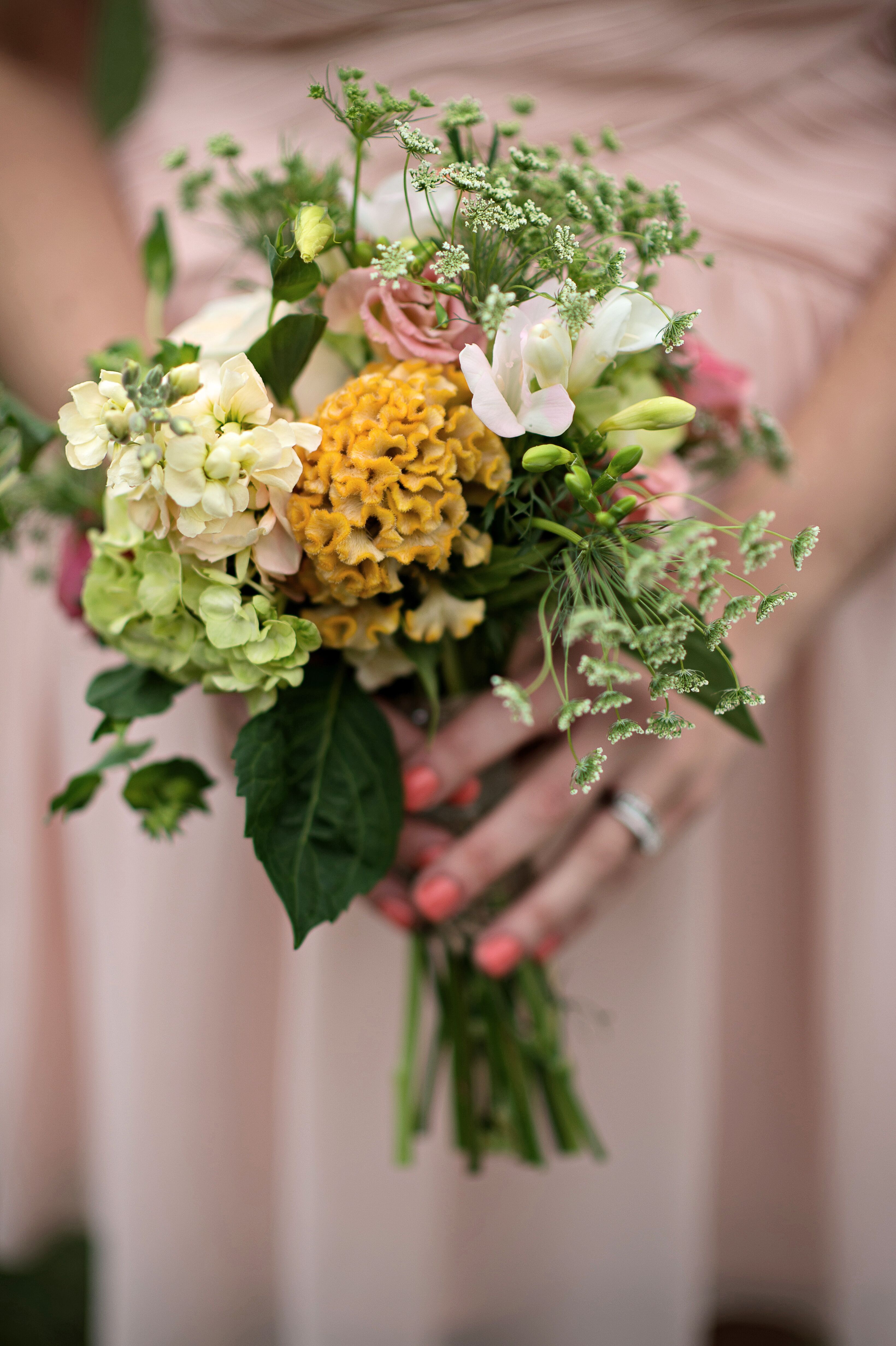 A Peach, Gold, and Green Bridesmaid Bouquet with Garden Roses, Freesias ...