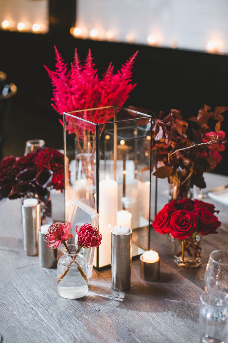 modern candle and red floral bud vase centerpieces