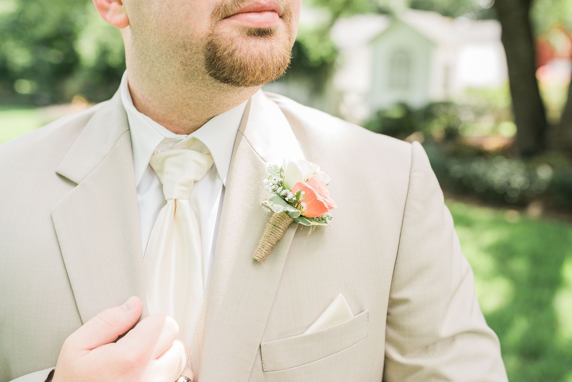 Tan Groom's Suit with Coral Boutonniere