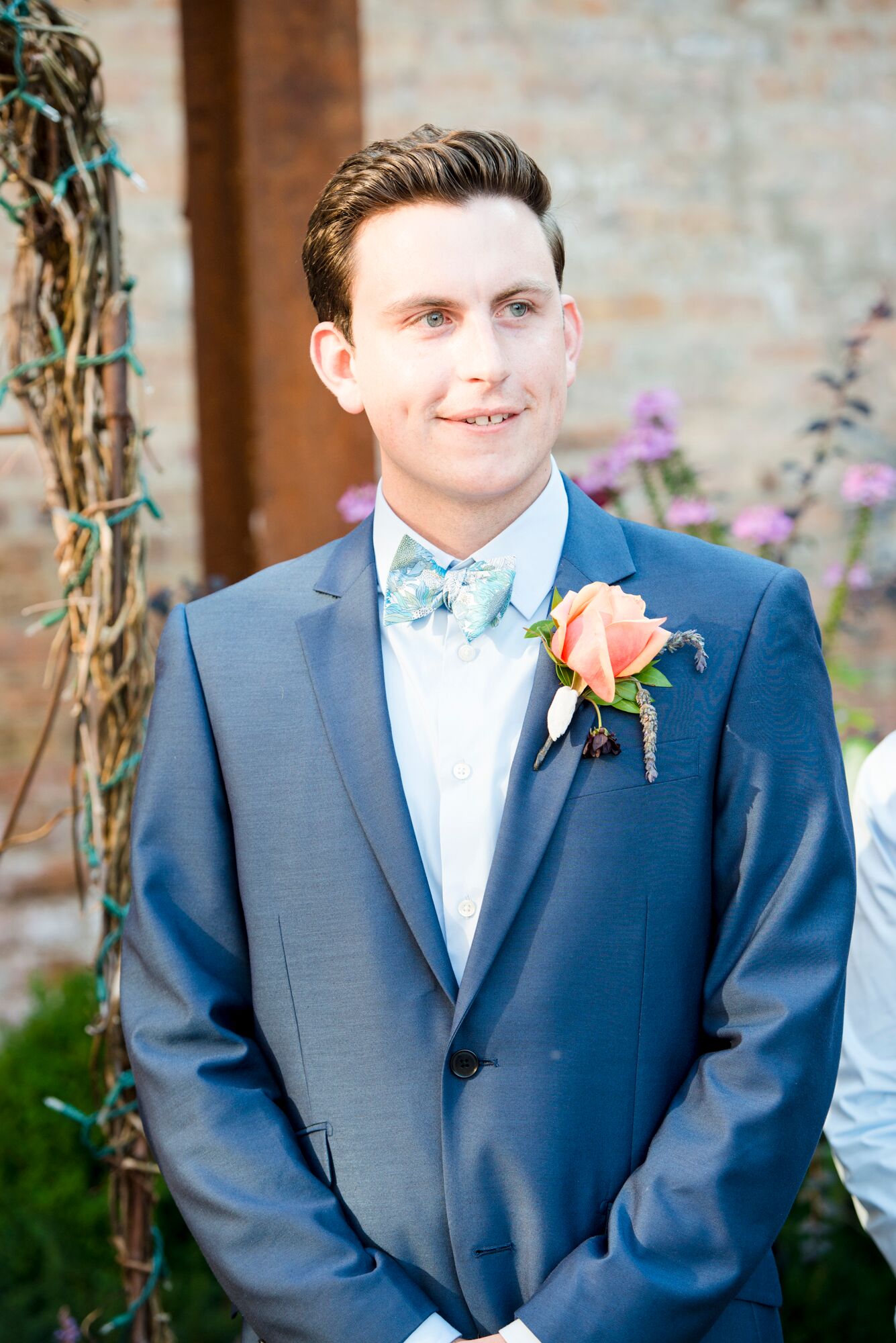 Groom Wearing Bow Tie and Rose Boutonniere