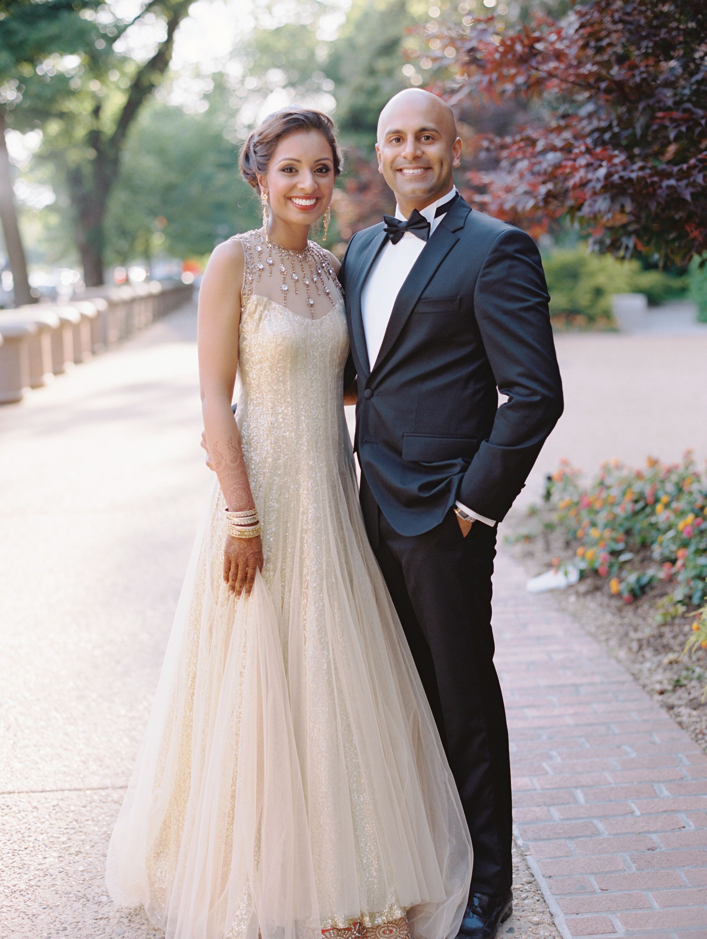 Bride in a Champagne Gown Groom in a Black Tuxedo for Reception