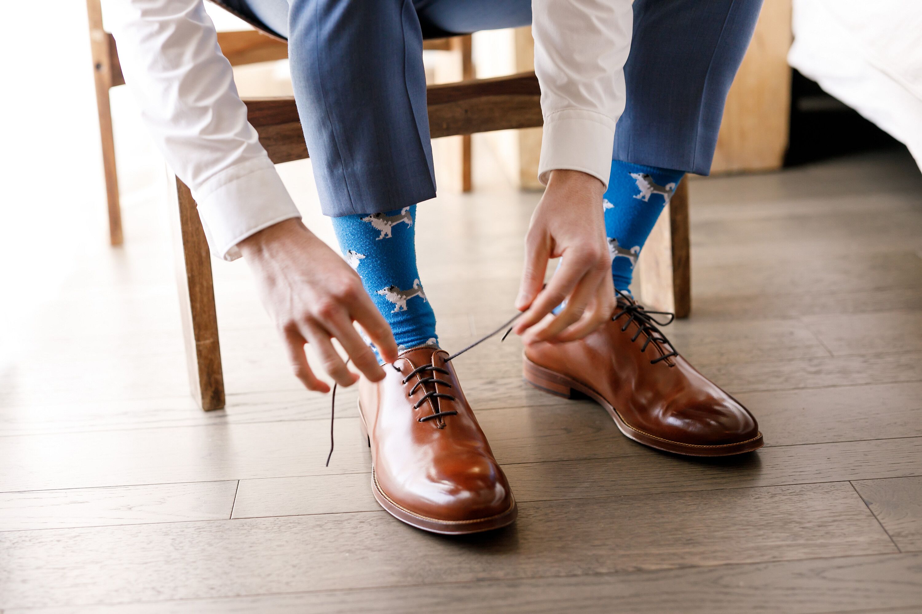 Groom Tying Shoes and Getting Ready for Austin, Texas, Wedding