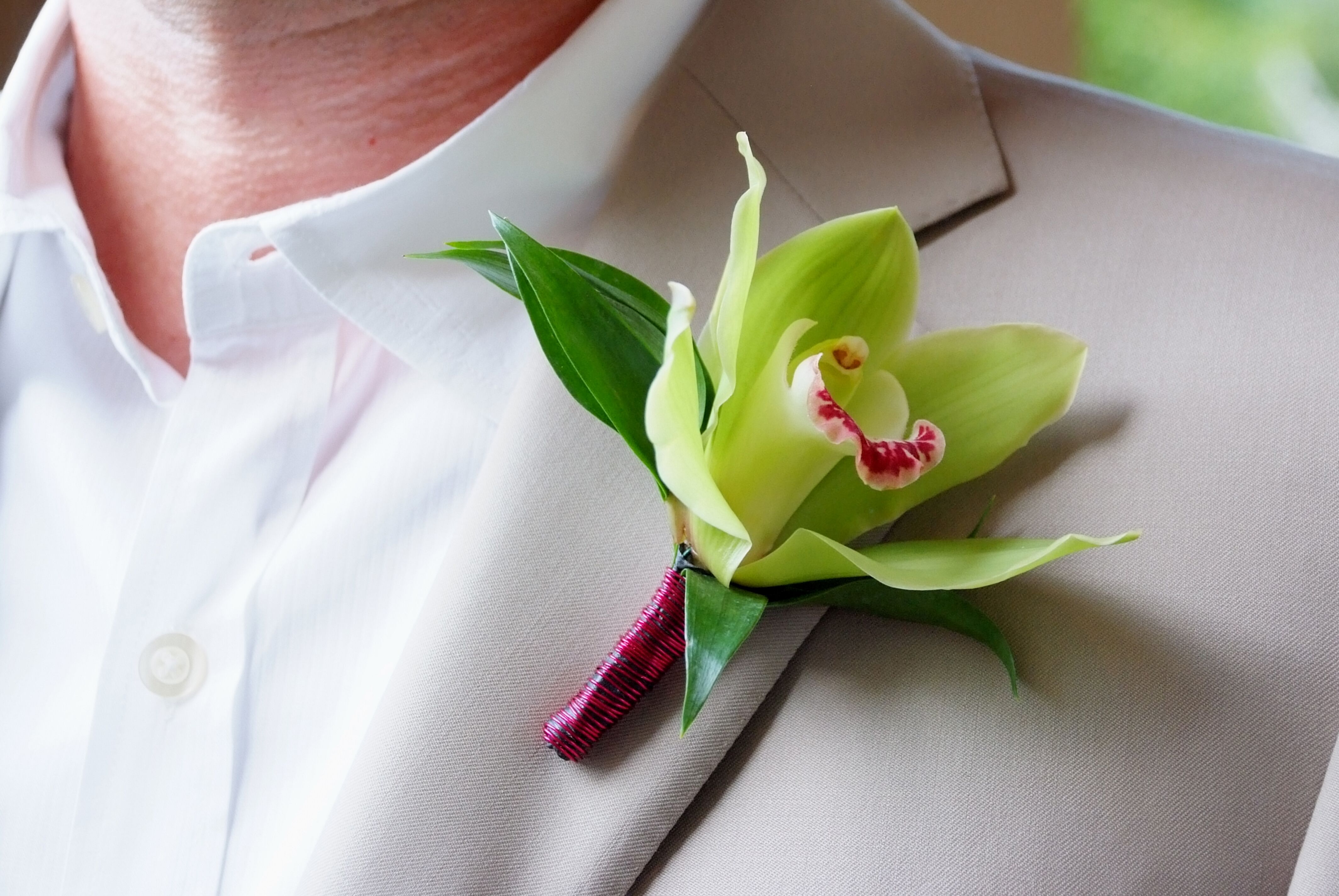 Groom’s Bright Green Orchid Boutonniere