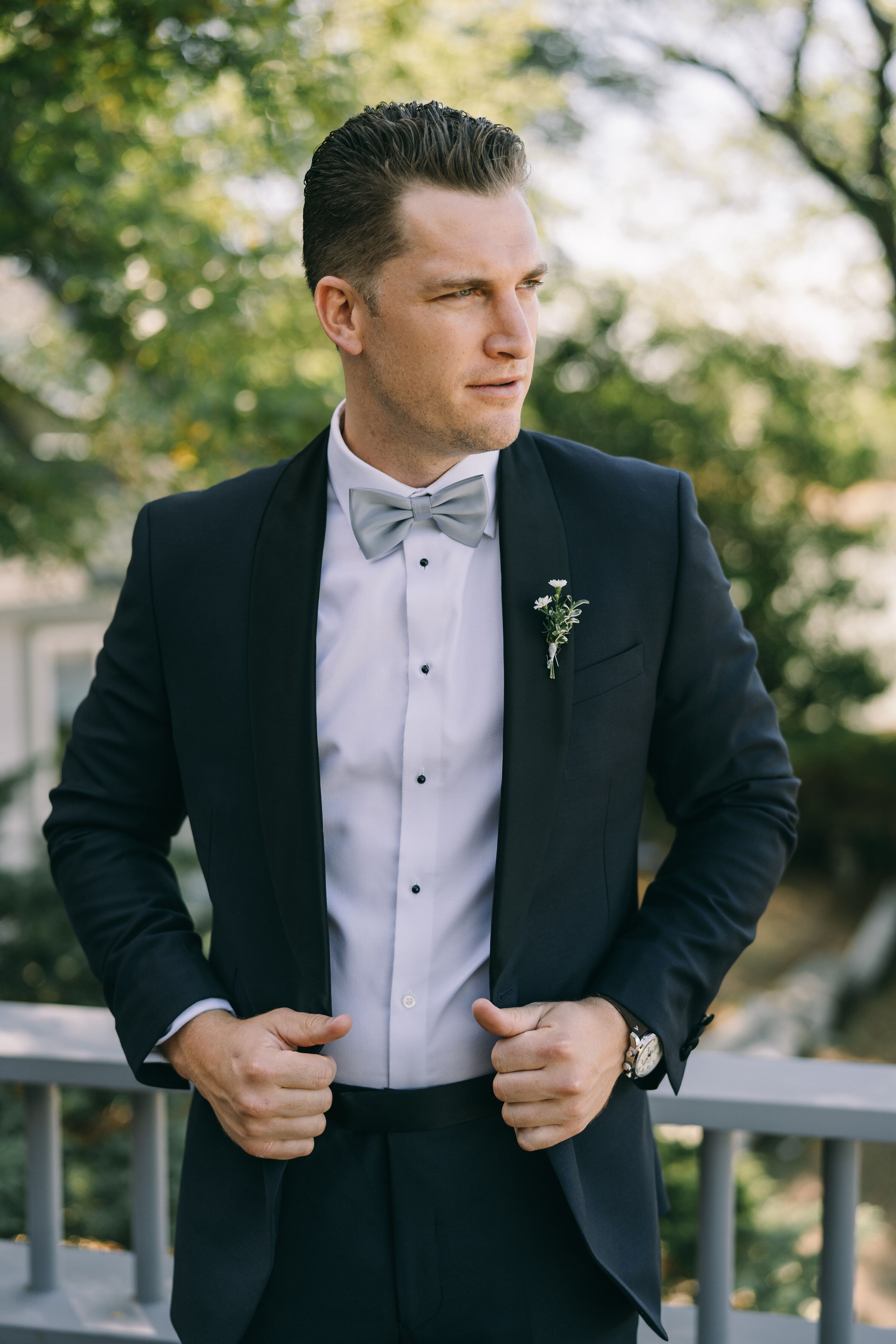 Groom Wearing Suit With Blue Bowtie