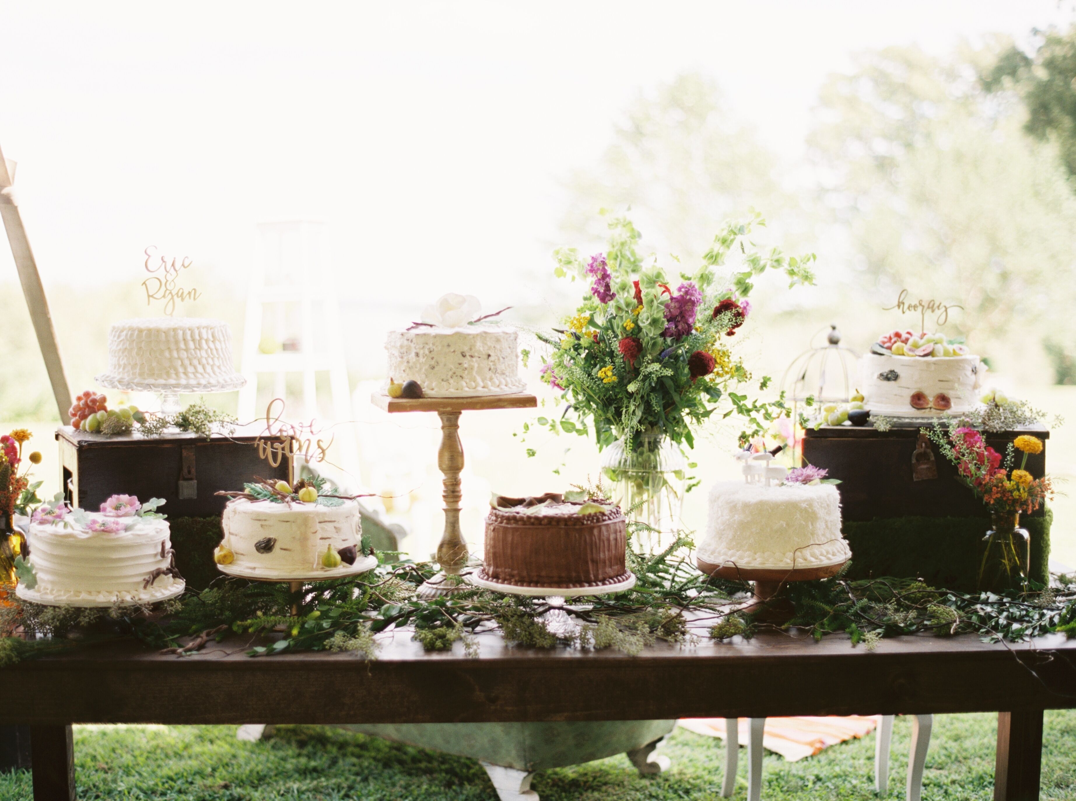 Dessert Table with Seven Single-Tiered Round Cakes