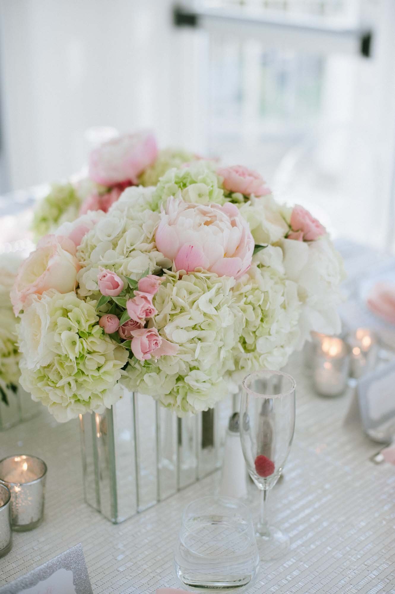 The centerpieces featured a lovely mix of light green hydrangeas, pink and ...
