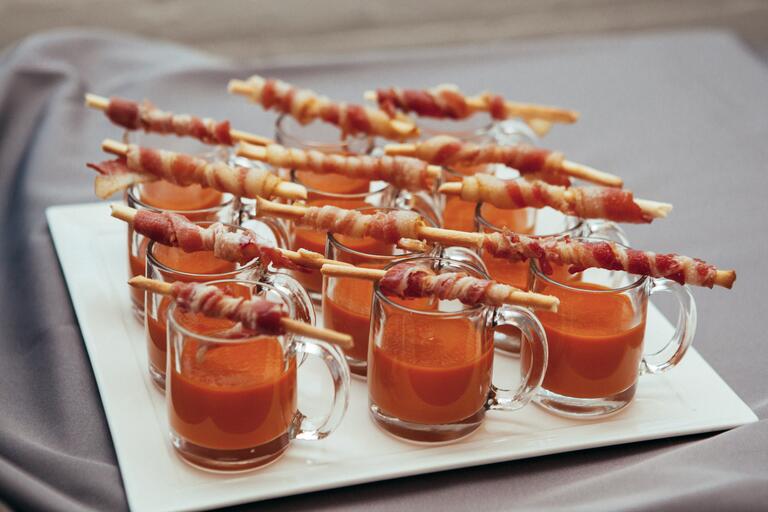 Tomato Soup Shooters Served With Bacon On A Stick