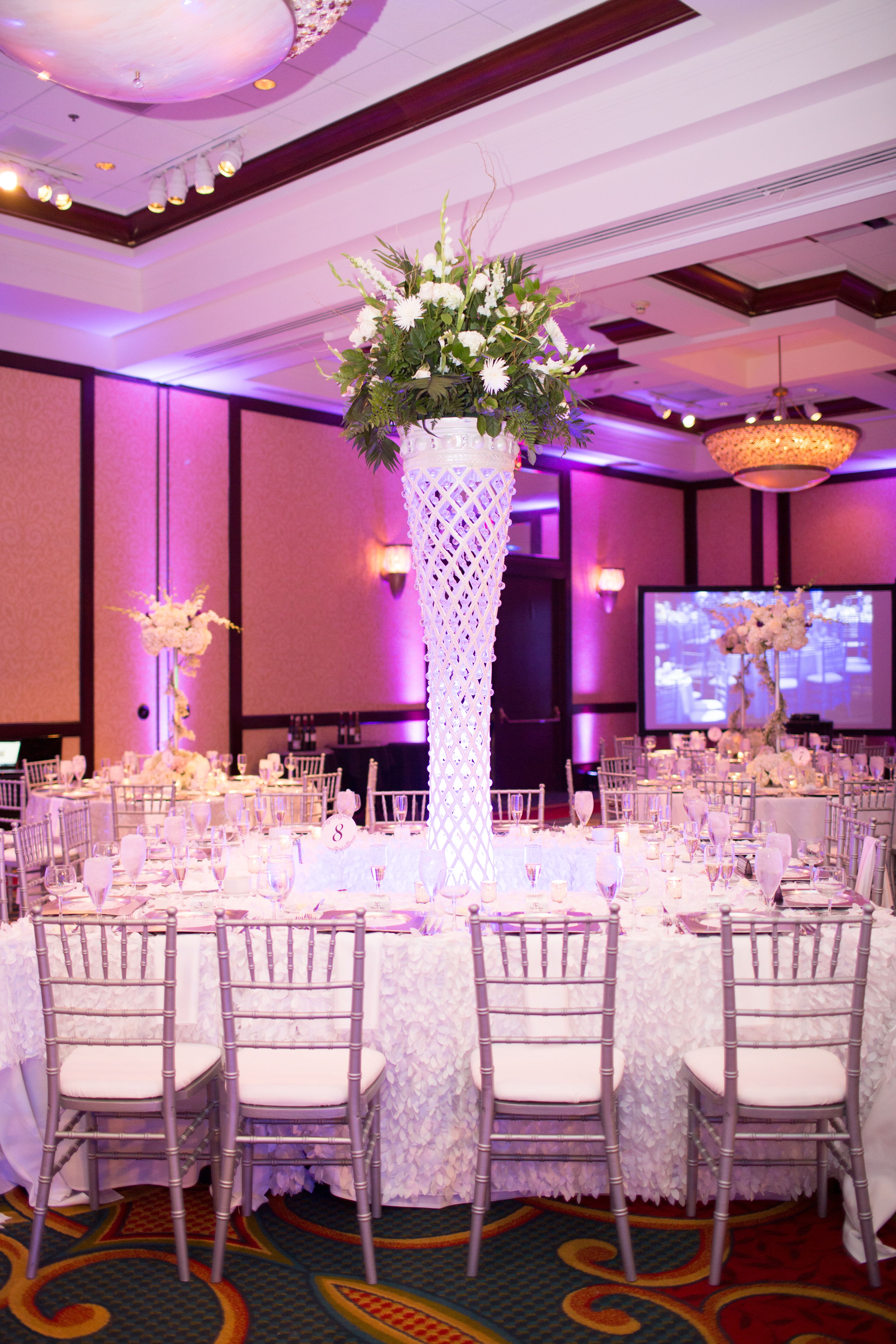 Whimsical Tall Floral Centerpiece in Netted Vase