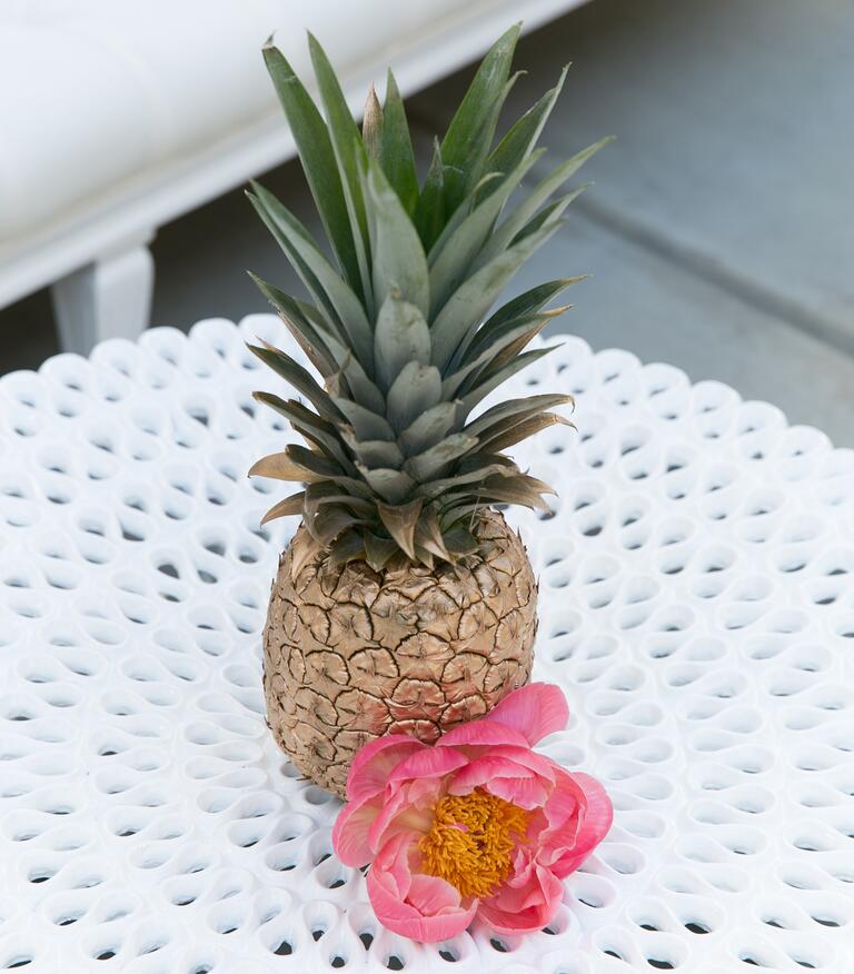 Gold painted pineapple and pink peony centerpiece 