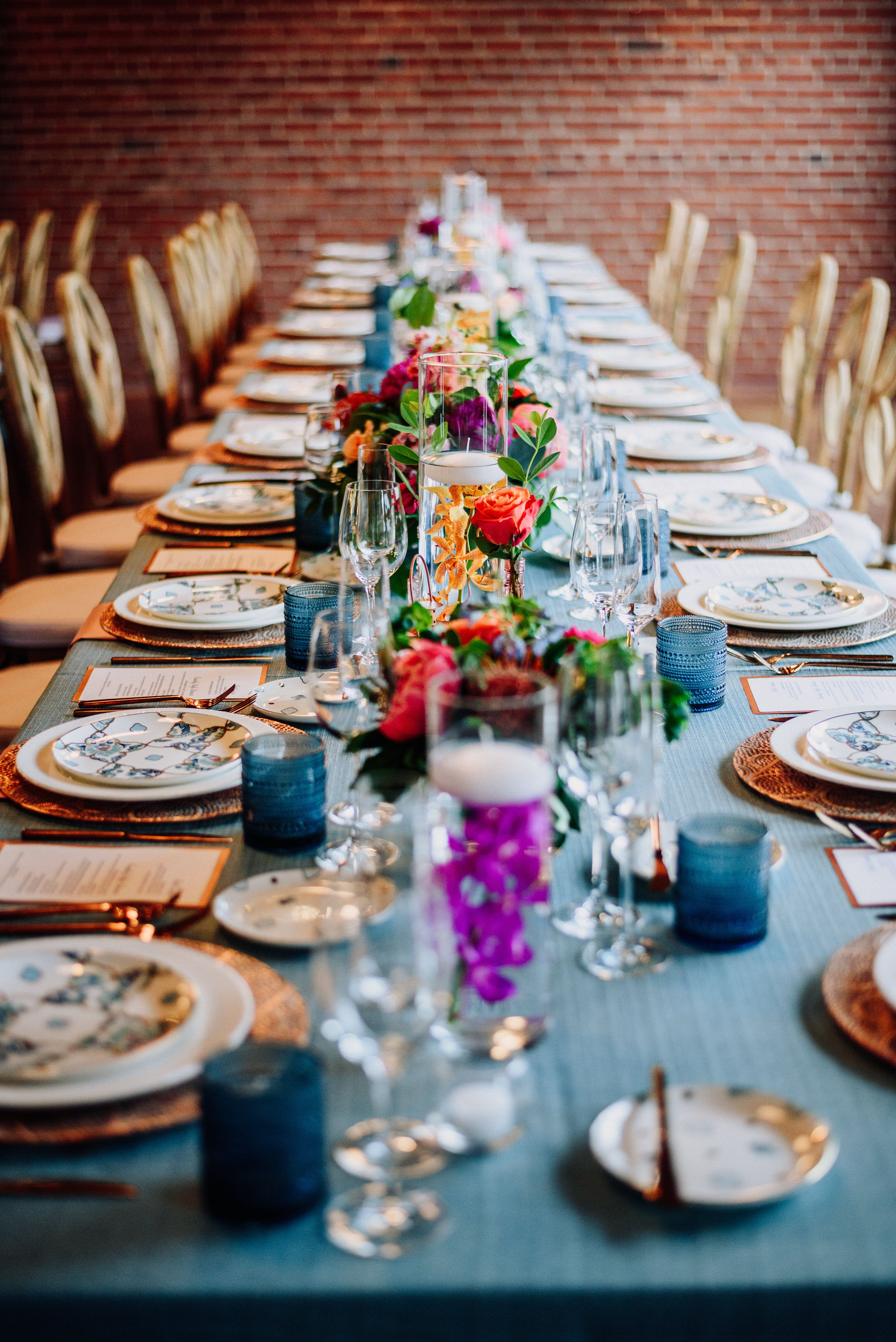 Rectangular Dining Table with Candles and Colorful Centerpieces