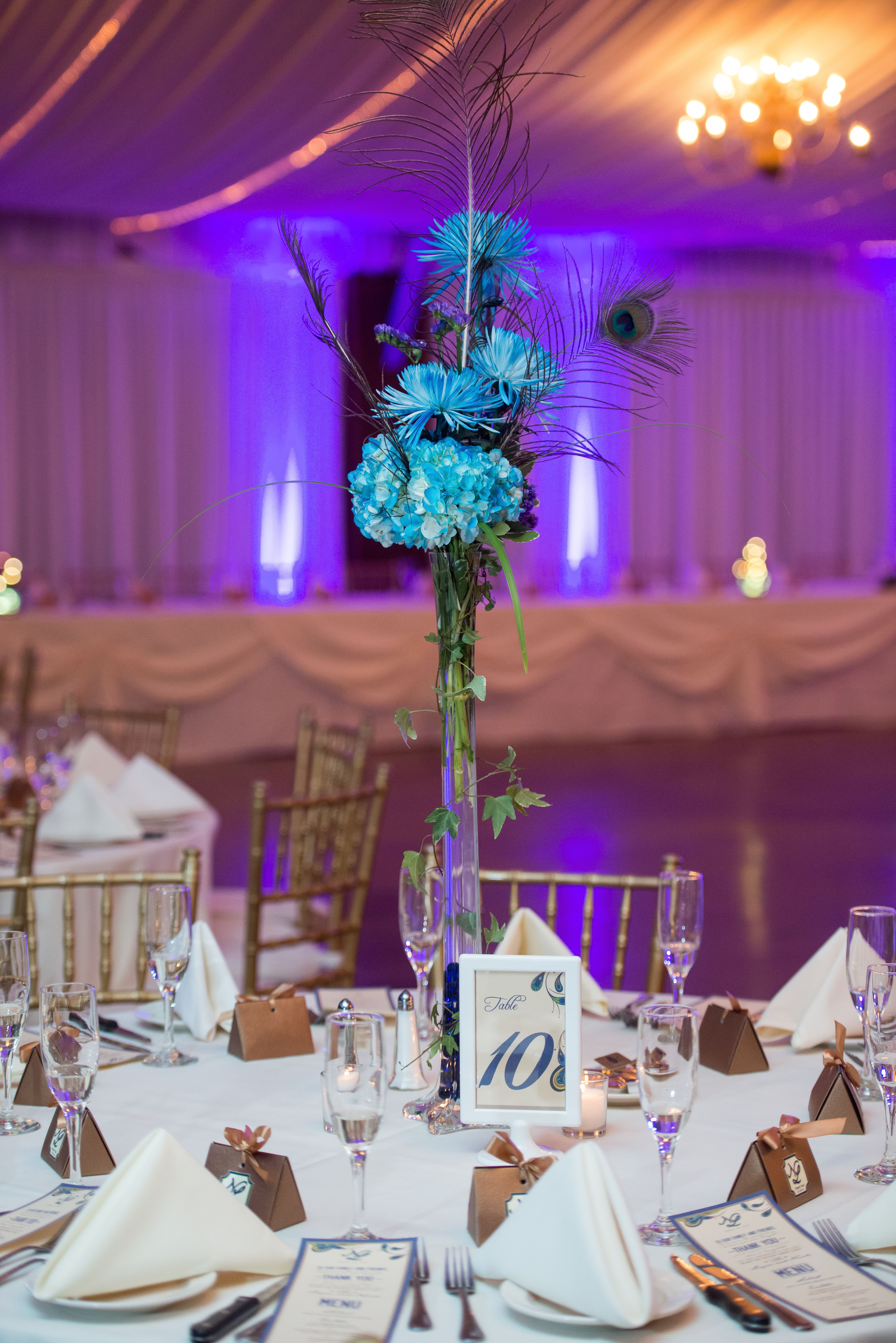 Tall, Blue Floral Centerpieces with Peacock Feathers