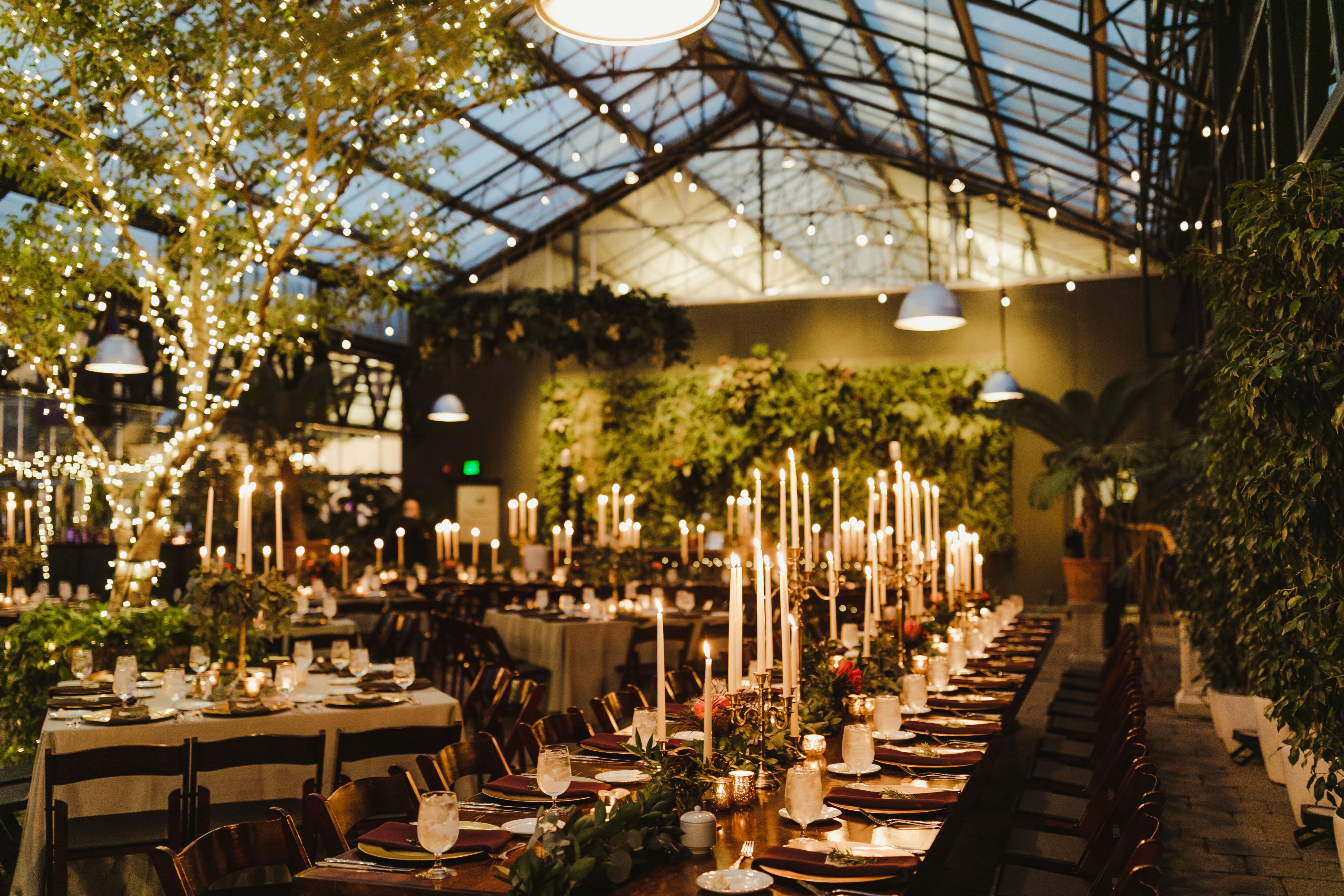 Cozy Greenhouse Reception Lit by Candles and String Lights