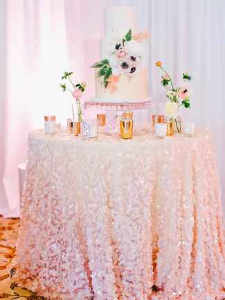 Light pink sequin table linen for a wedding cake dessert table