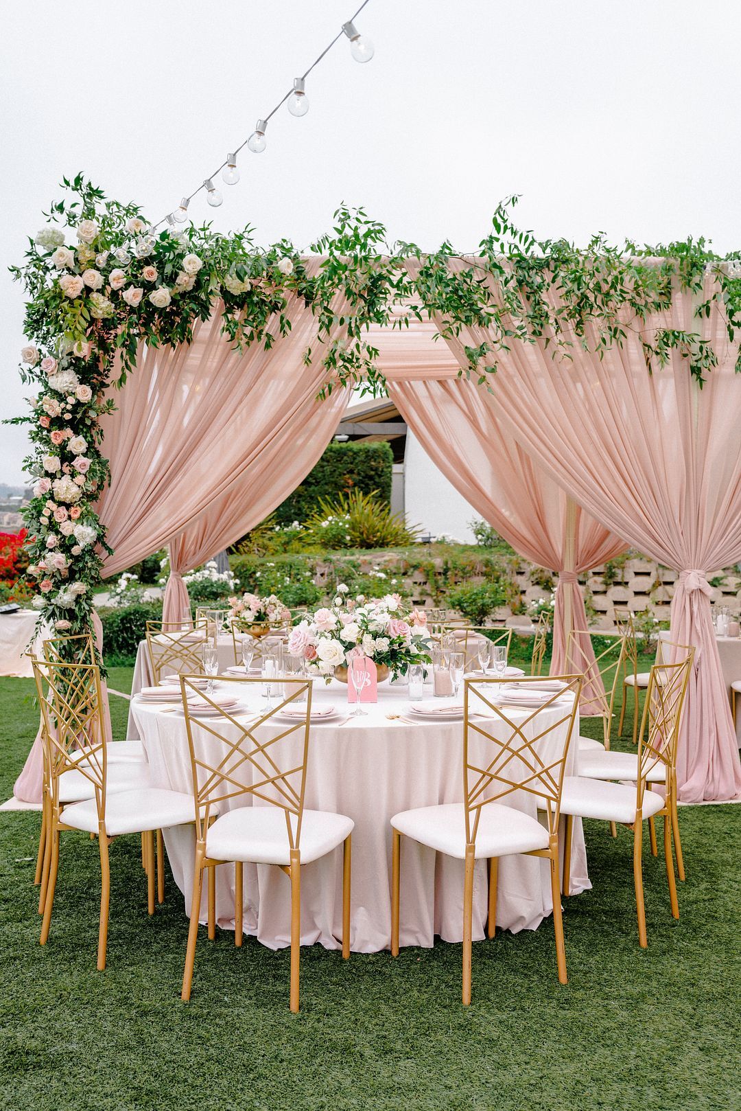 Blush Drapes and Gold Chairs as Wedding Reception Decor