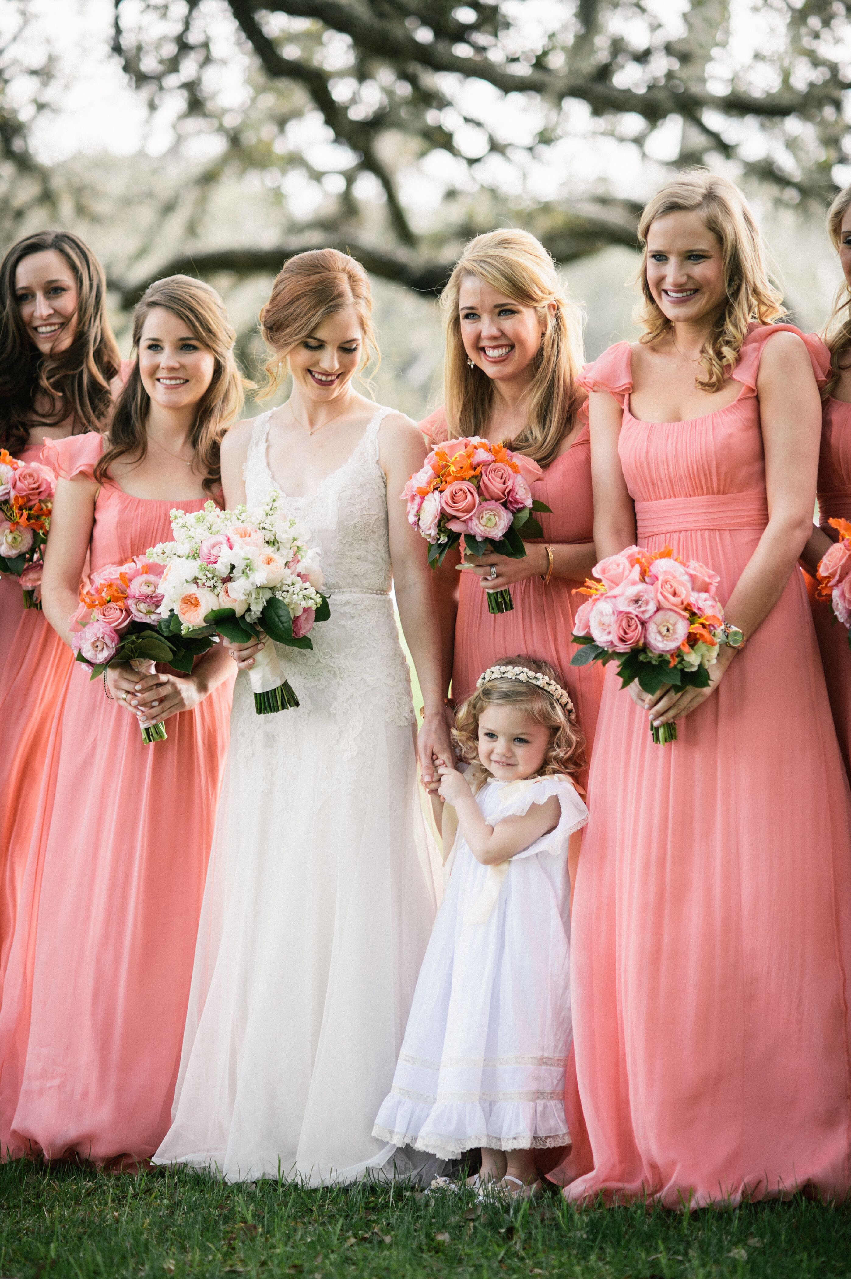 Coral Pink Bridesmaid Dresses and Rose Bouquets