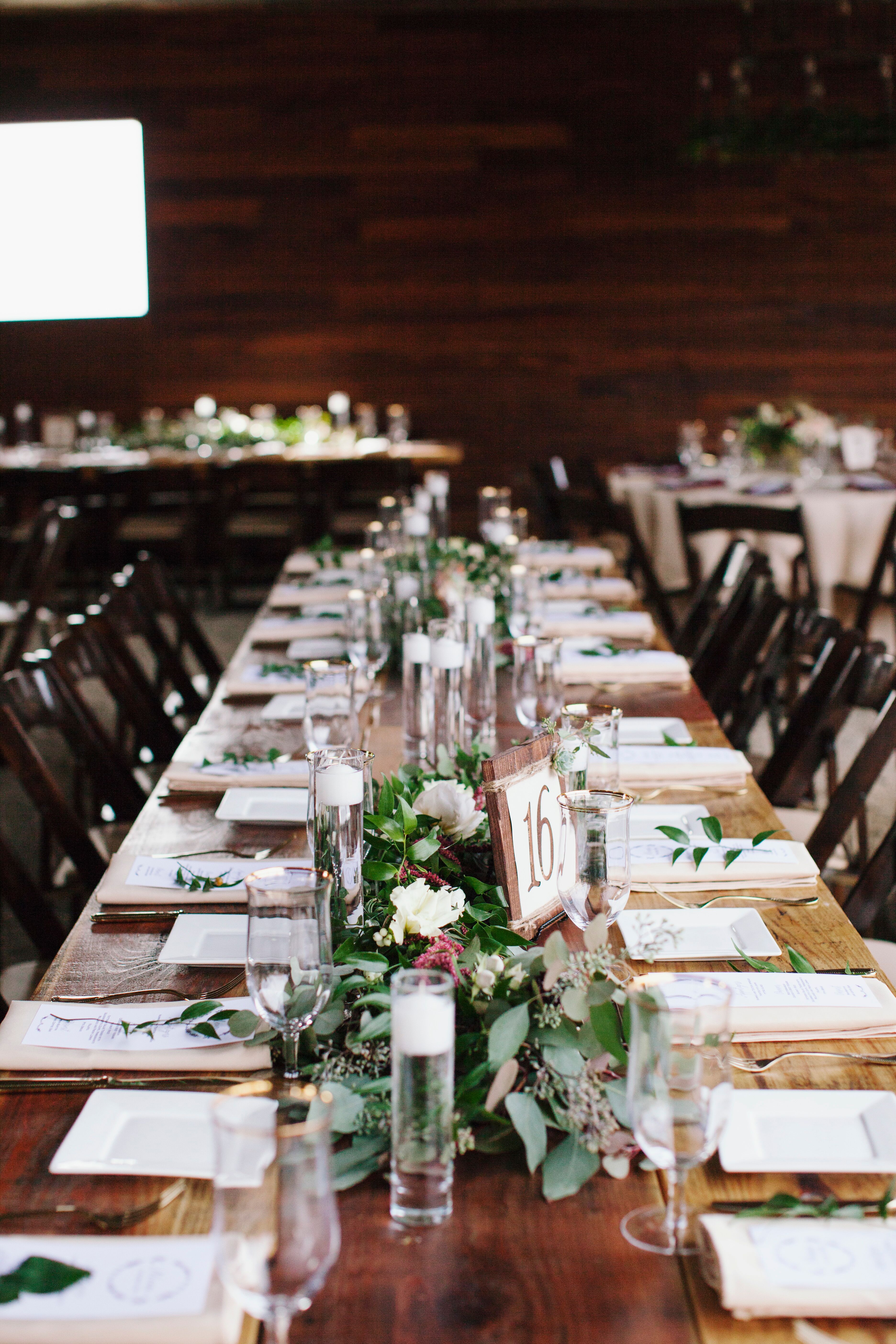 Elegant Ranch Tables Settings with Greenery