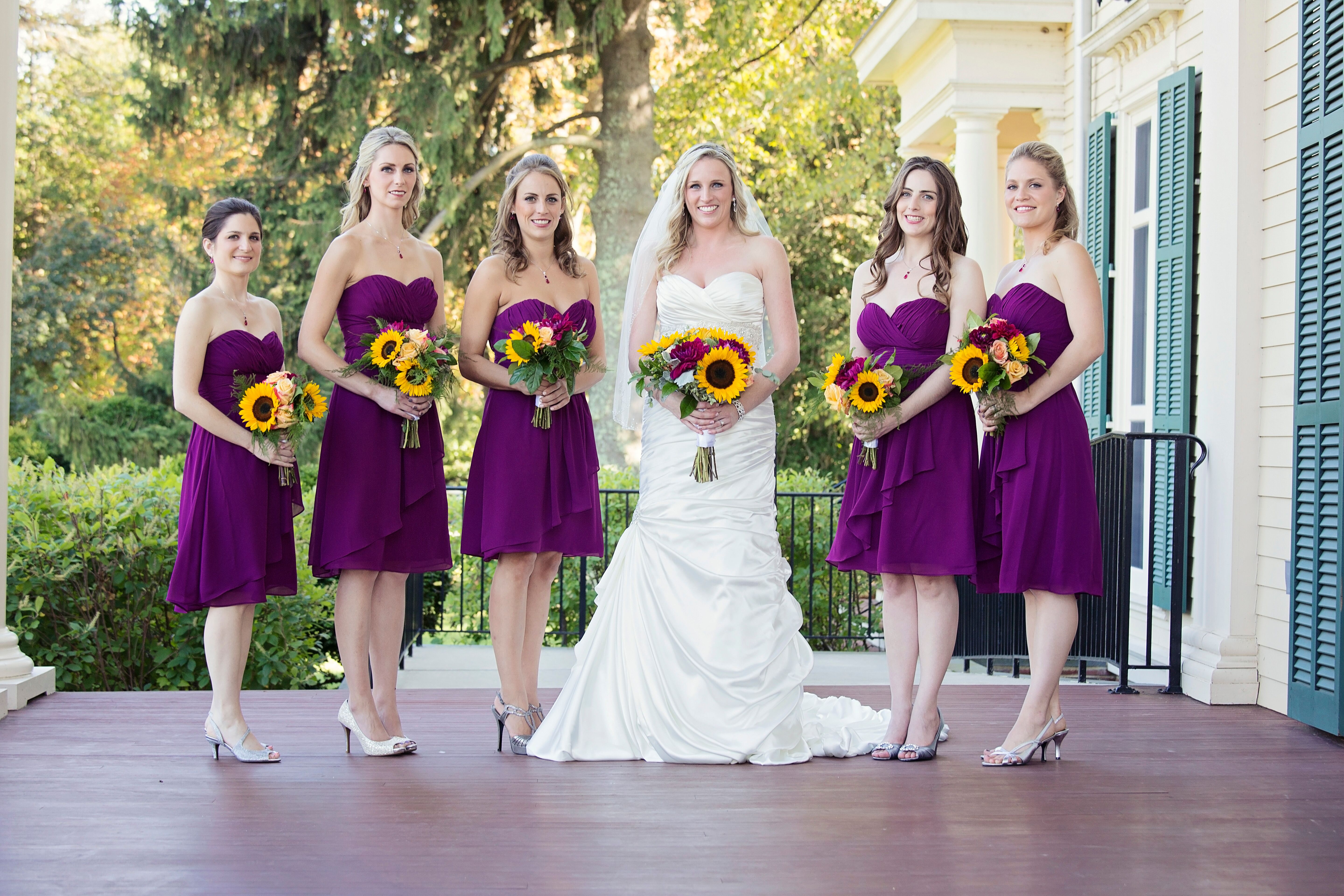 Purple bridesmaid dresses with sunflowers