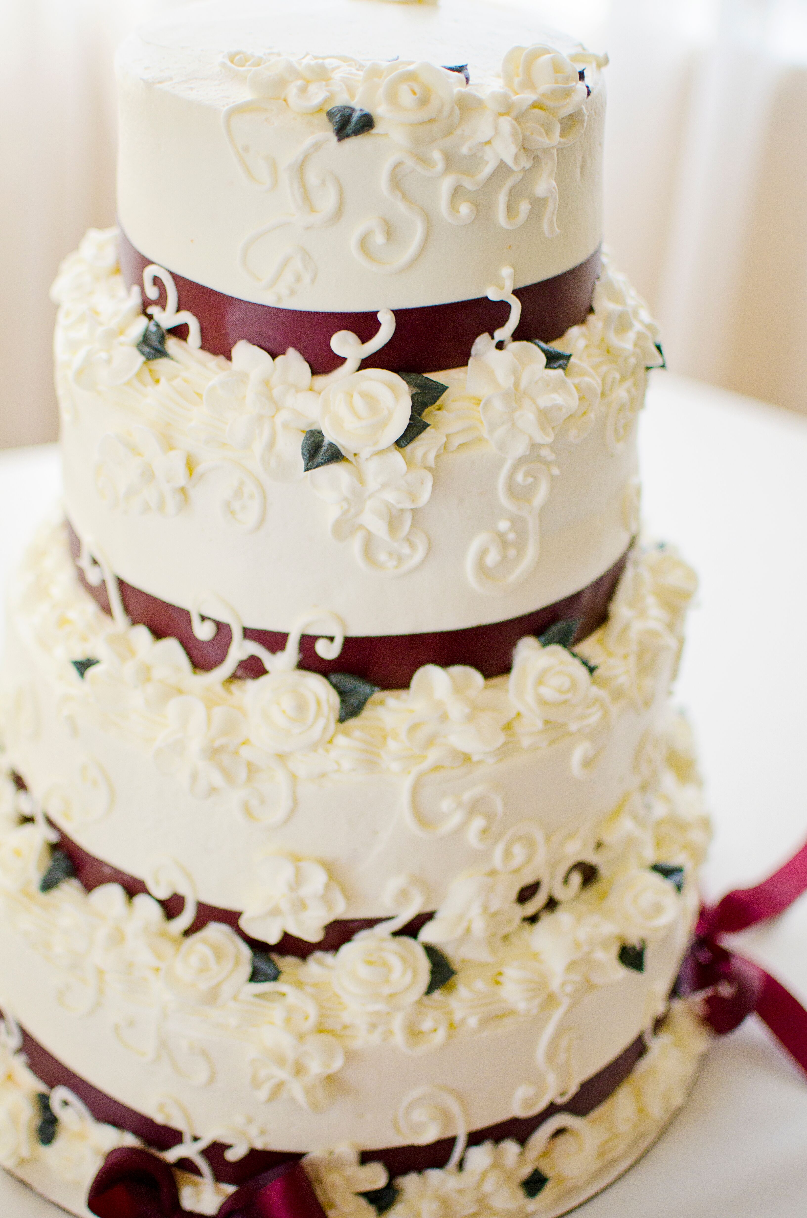 Tiered Wedding Cake With Red Ribbon