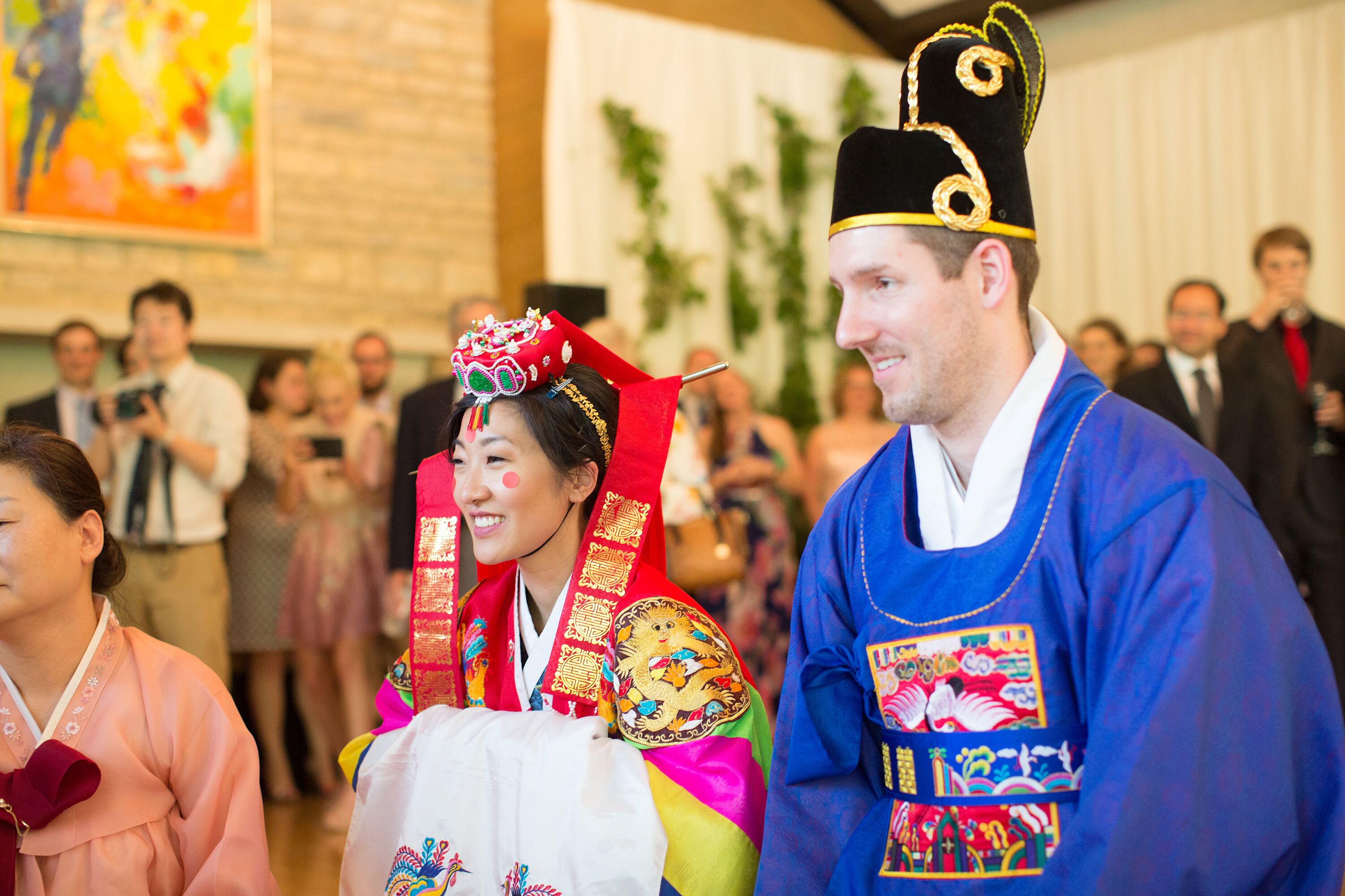 Bride and Groom in Hanboks During Traditional Korean Pyebaek Ceremony