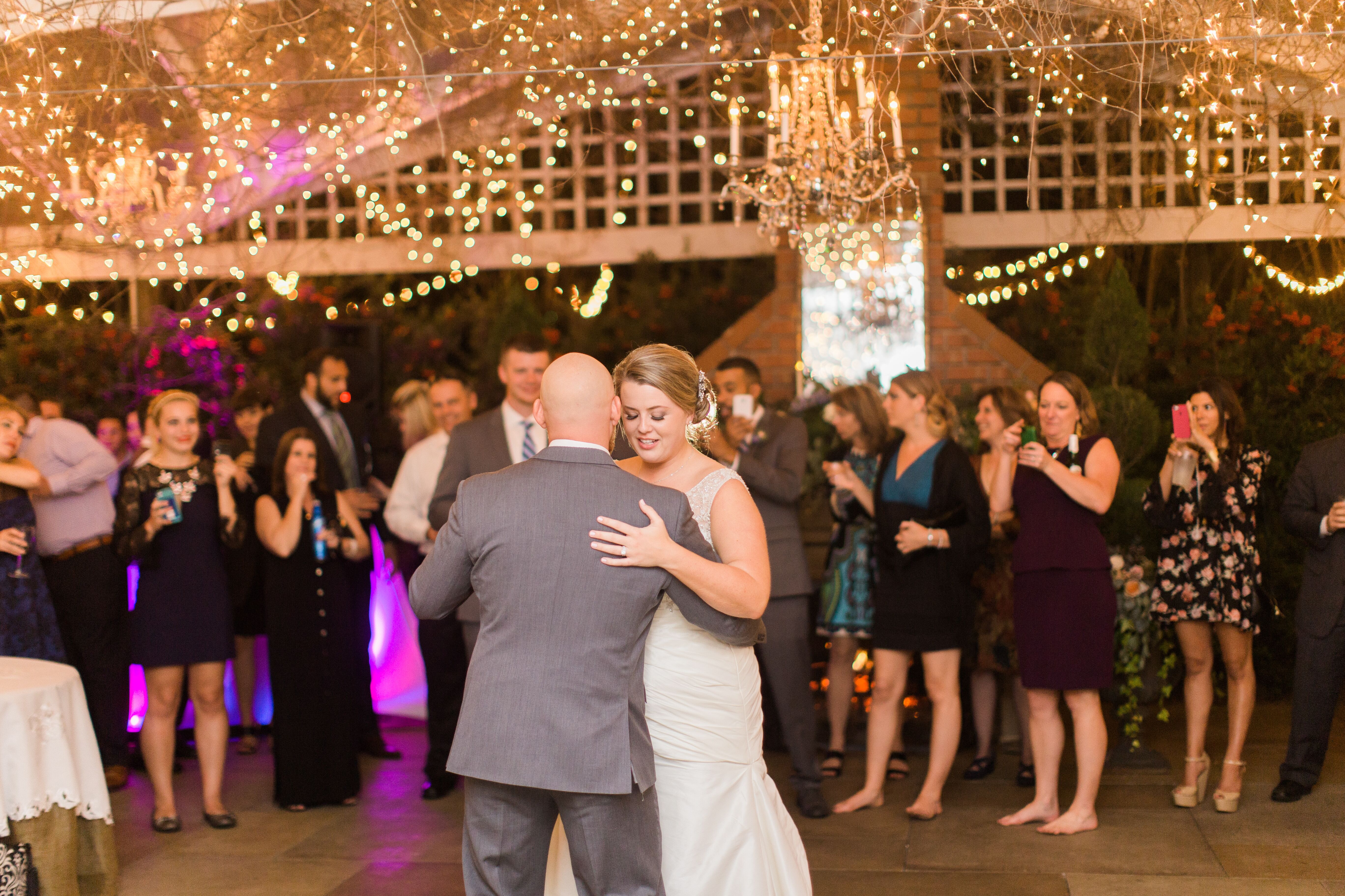 Dance Floor With String Lights and Crystal Chandelier