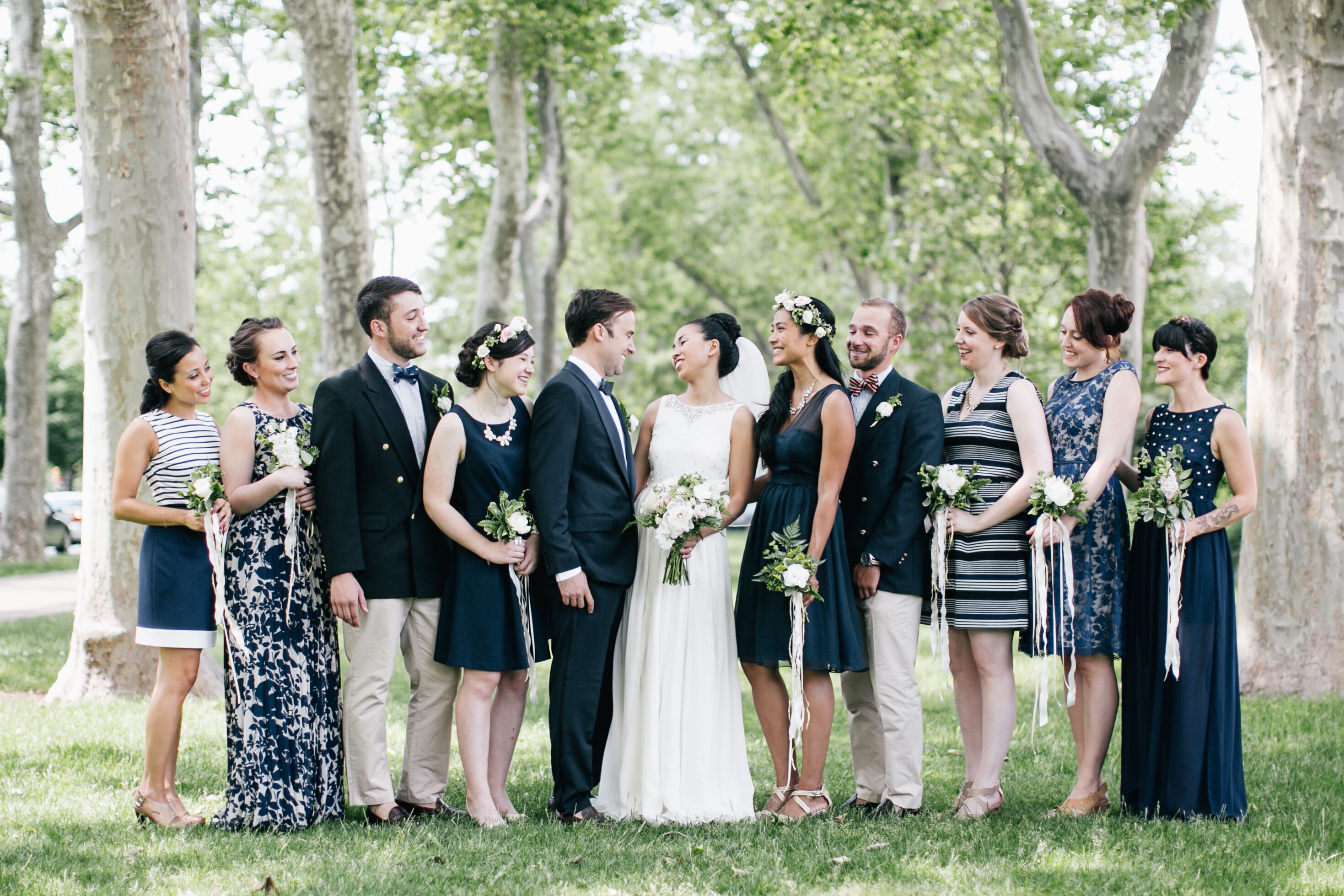 Married Couple and Navy Blue Wedding  Party 