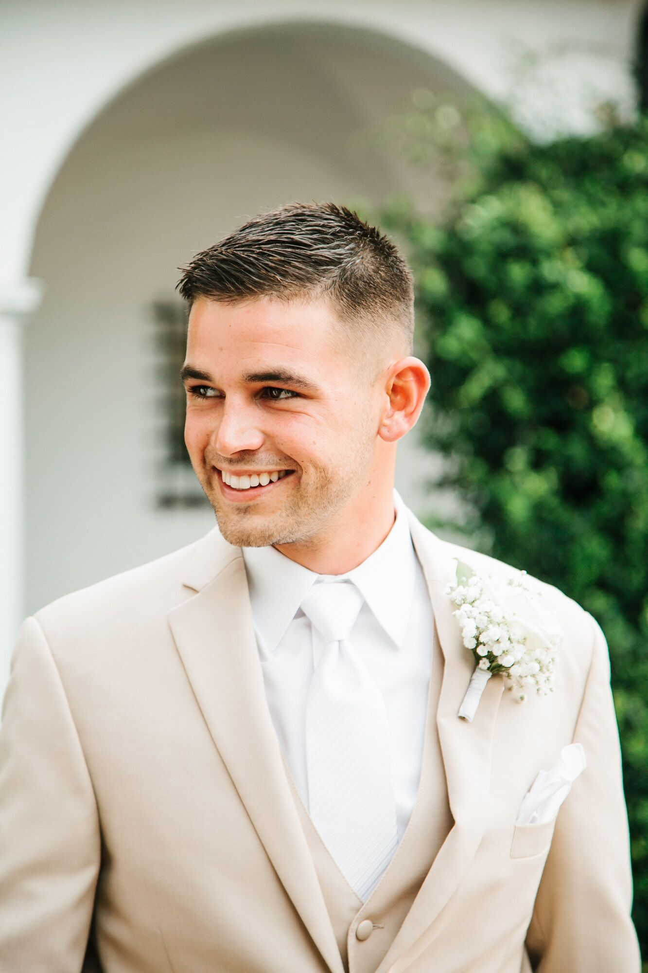 Groom in Tan Tuxedo with White Boutonniere