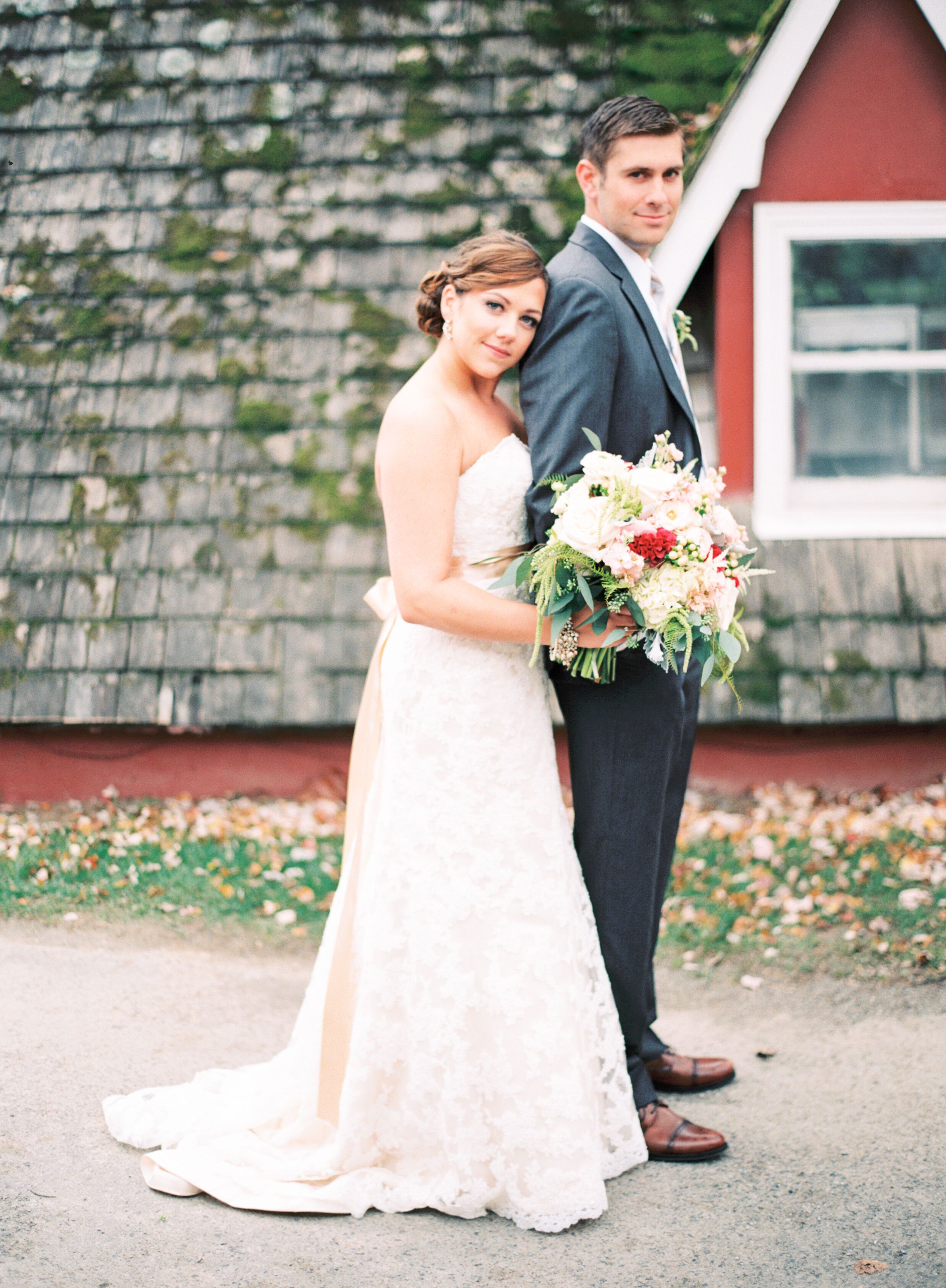 Bride in an Ivory and Champagne Dress Groom in a Gray Suit