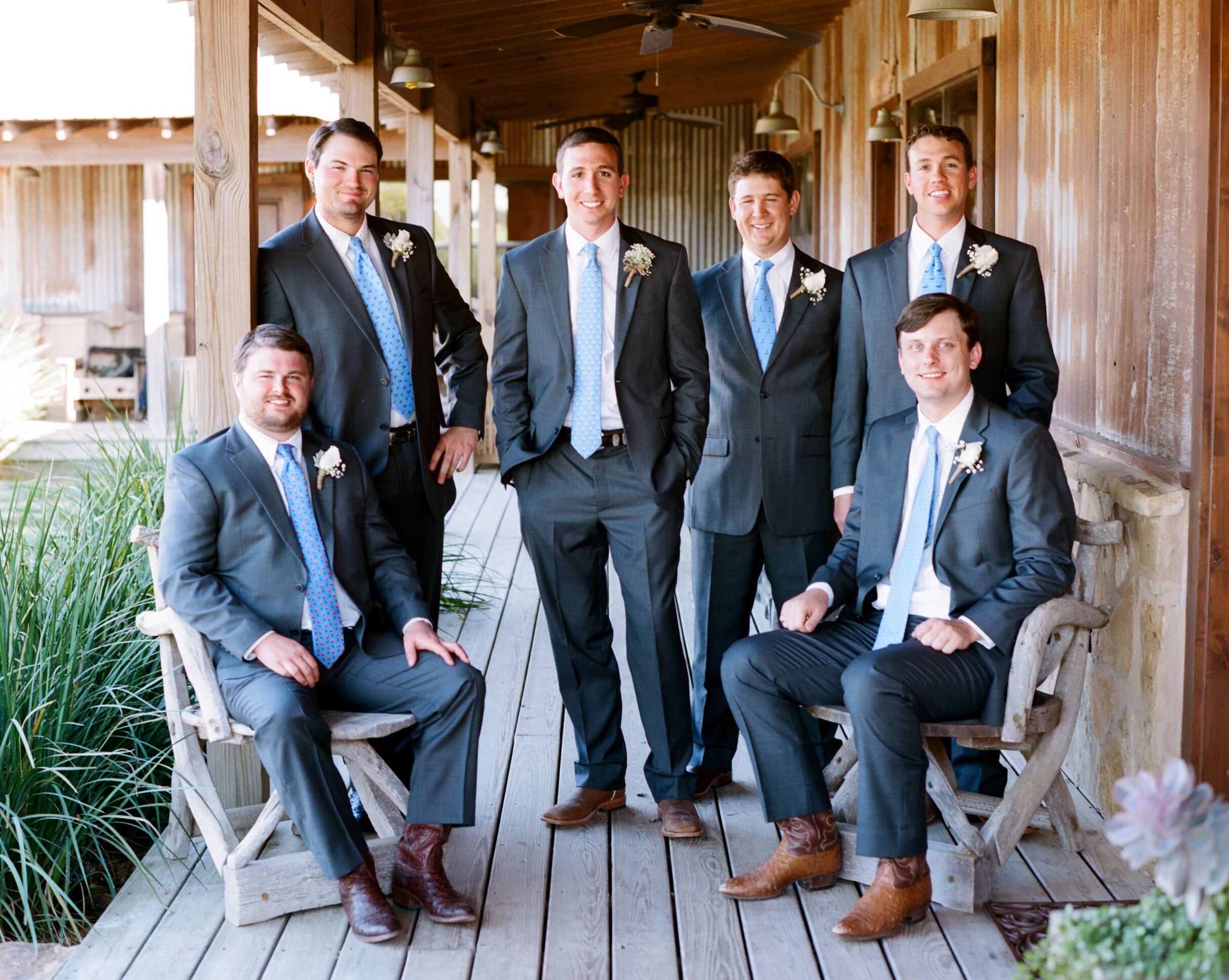 black suit with cowboy boots