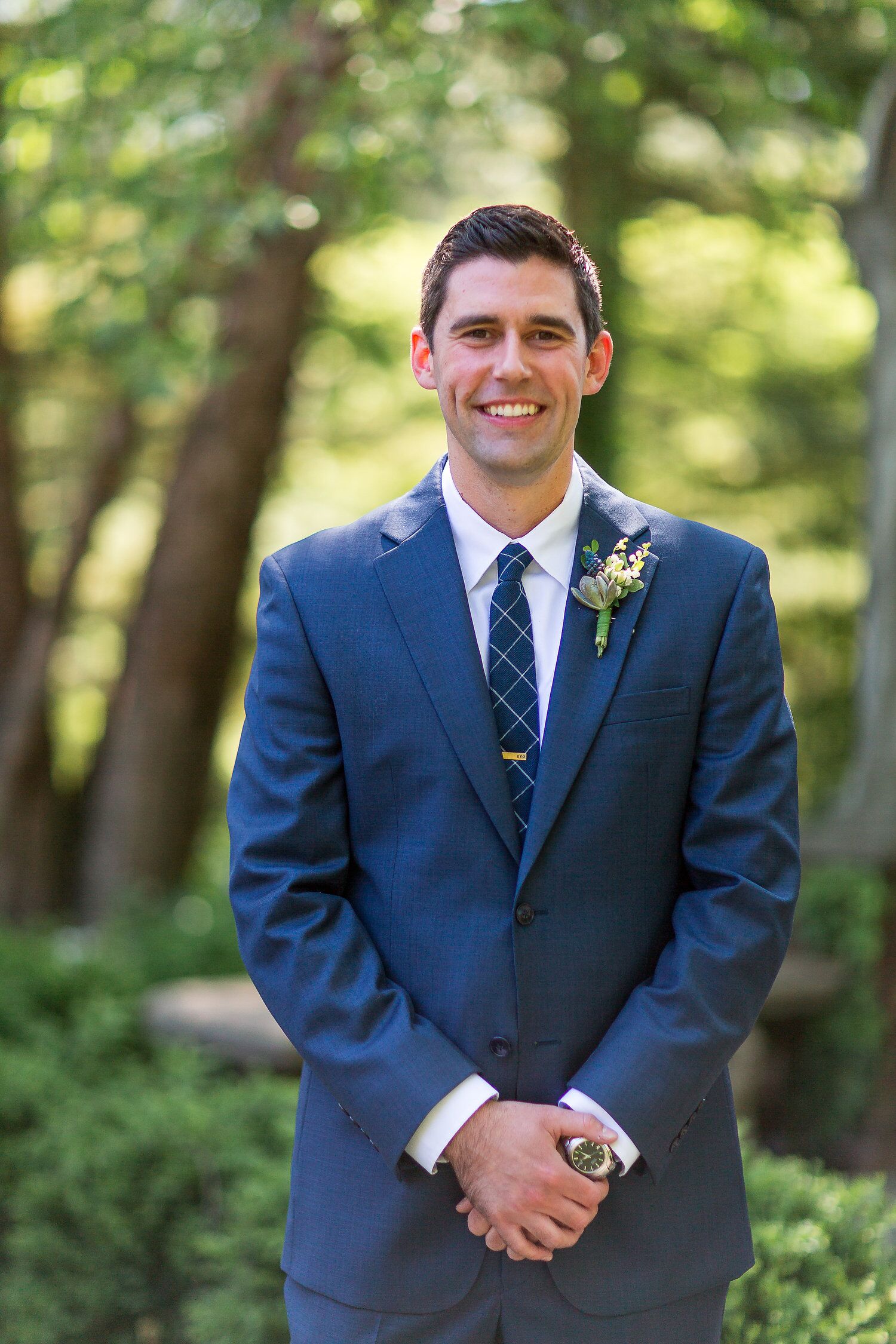 Navy Groom Suit With A Checkered Navy Tie