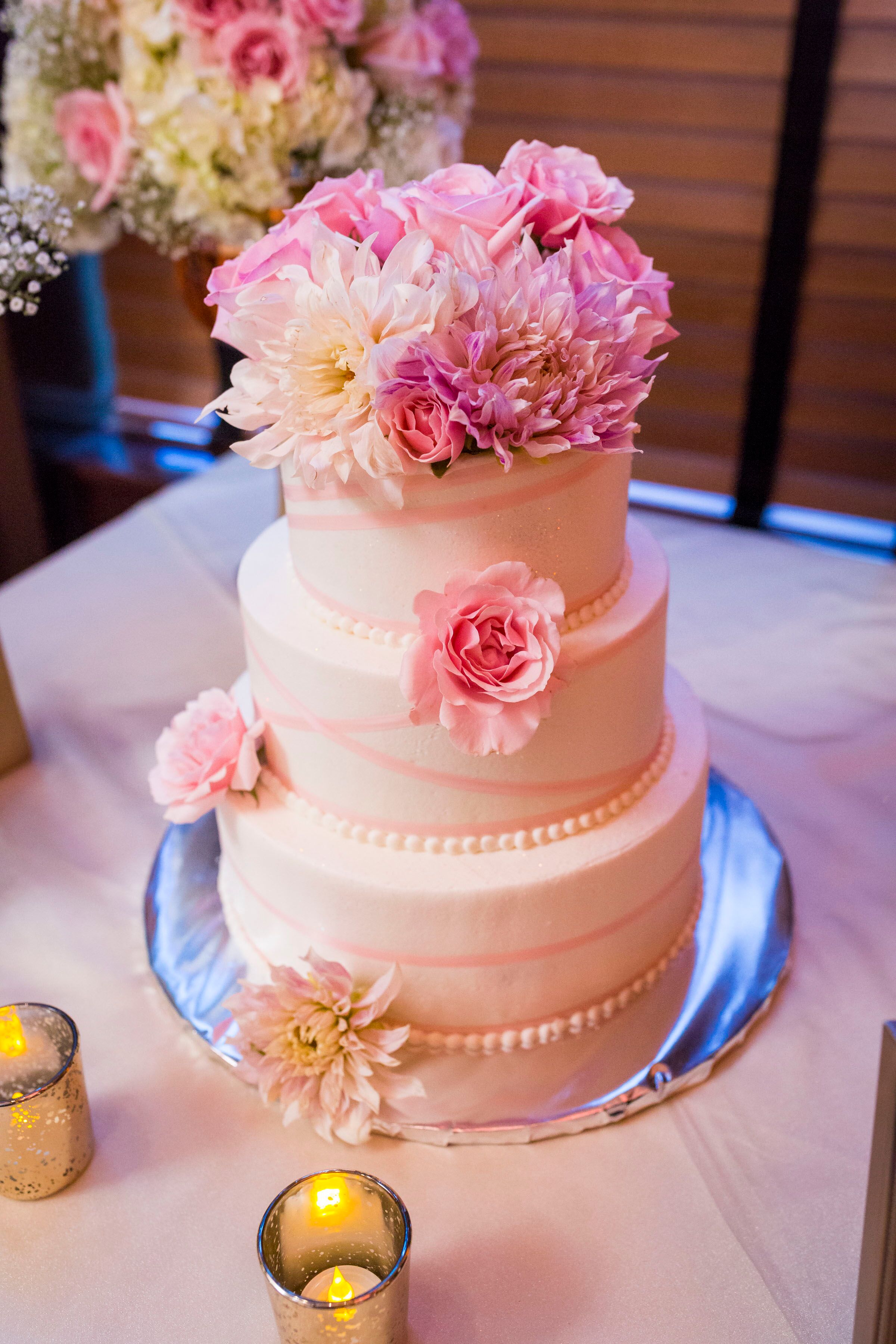 Three-Tier White Wedding Cake with Pink Flowers