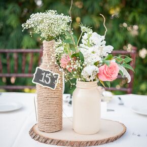 Ivory Dining Table with Rustic Centerpieces