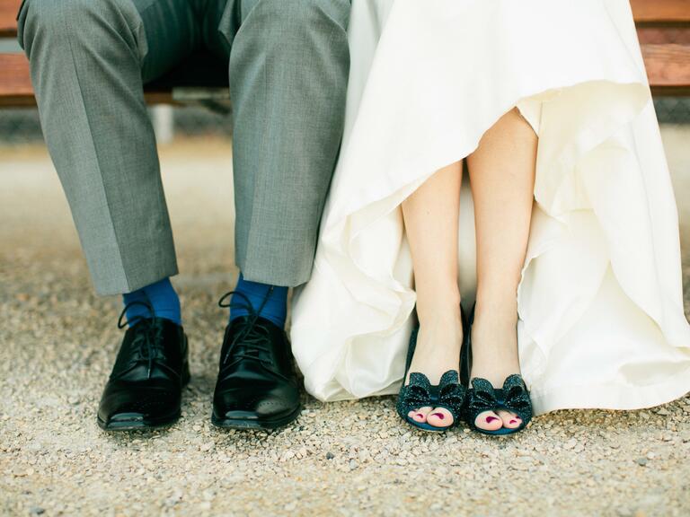 Groom's shoes and bride's blue sparkly heels