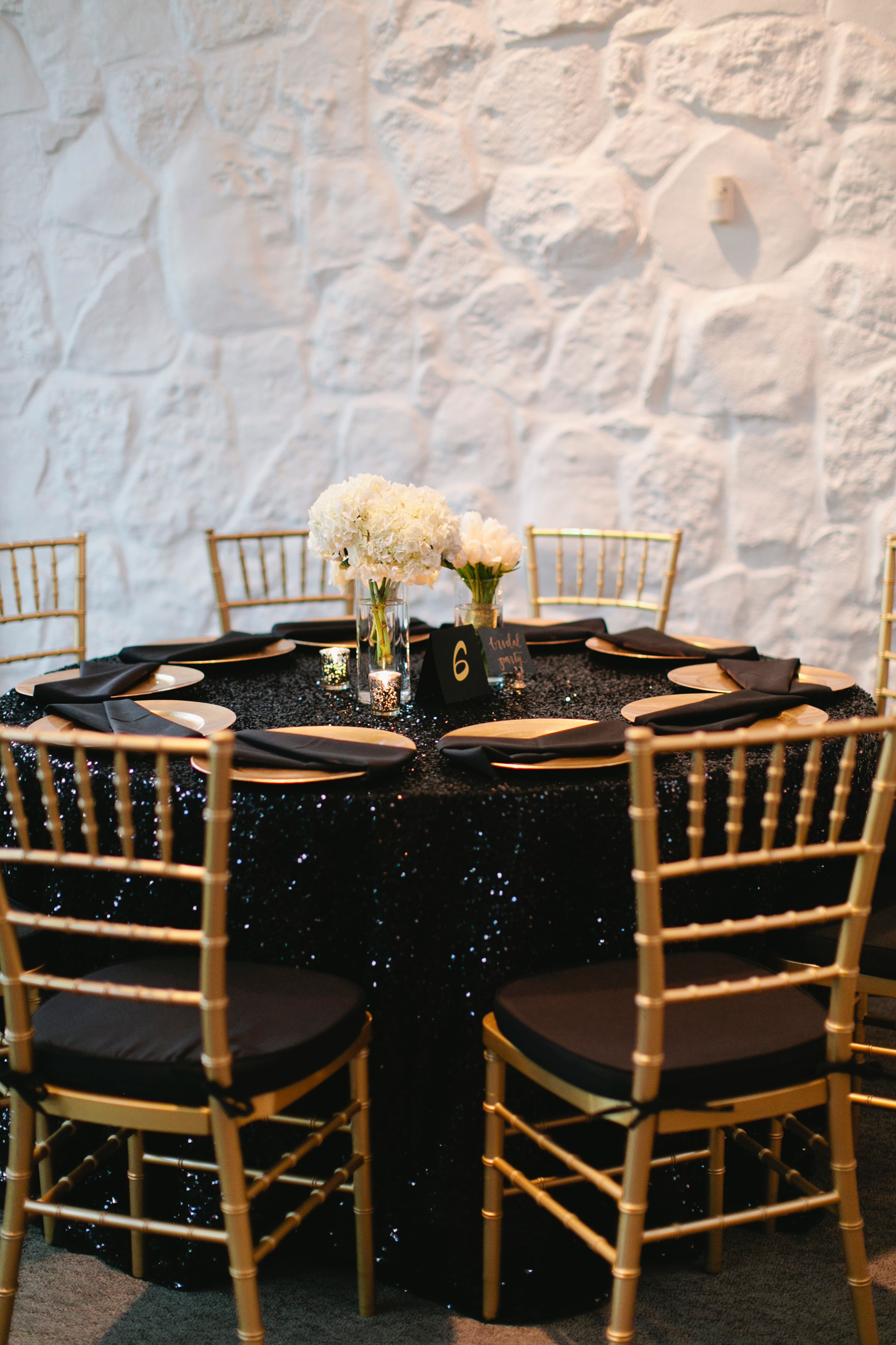 Black-Sequined Dining Table With Gold Chiavari Chairs